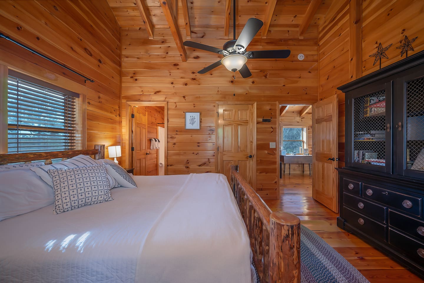 Primary bedroom with king bed upstairs with full bathroom