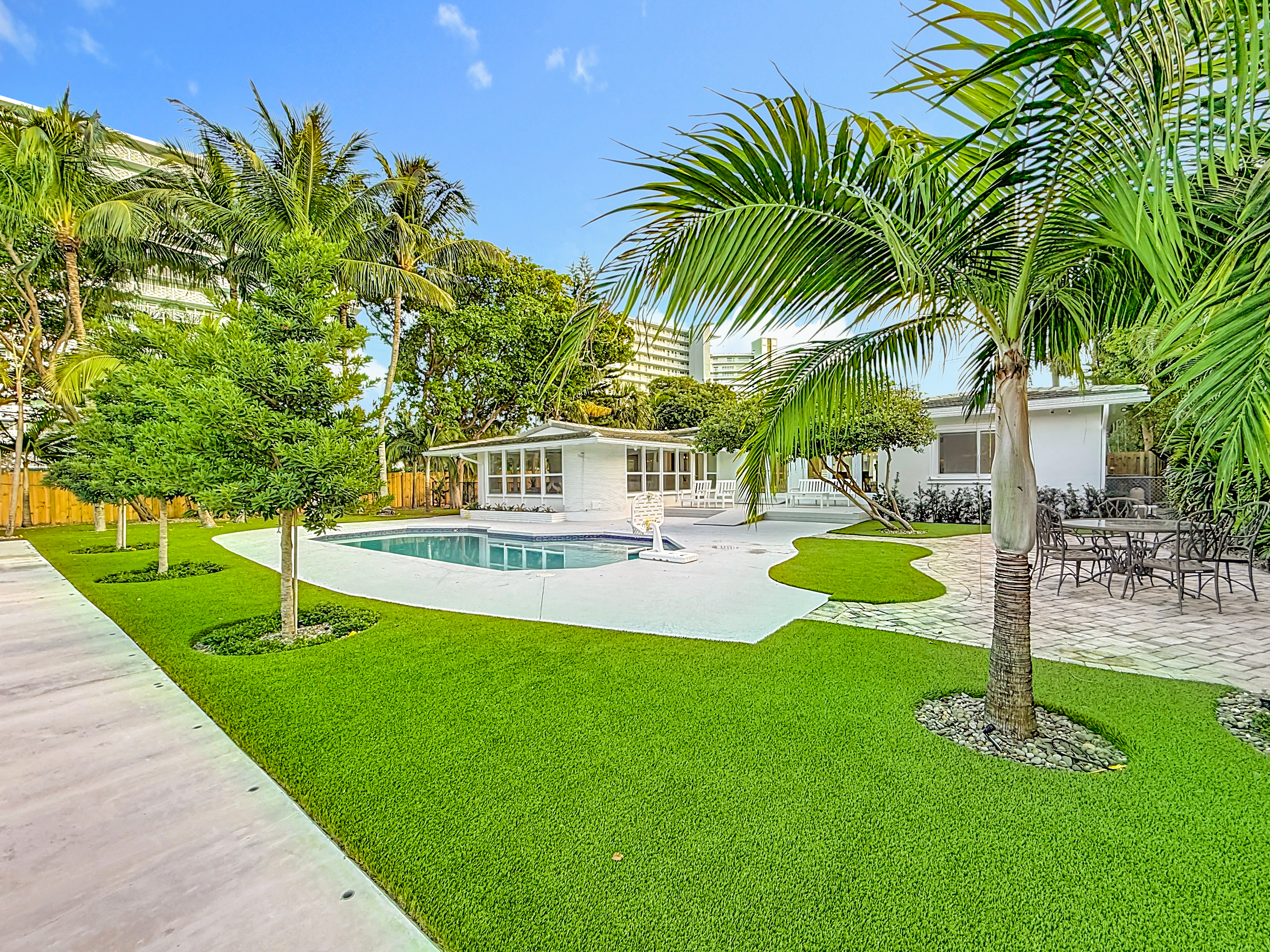 High end turf and beautiful landscaping make the pool area a great hang spot. 