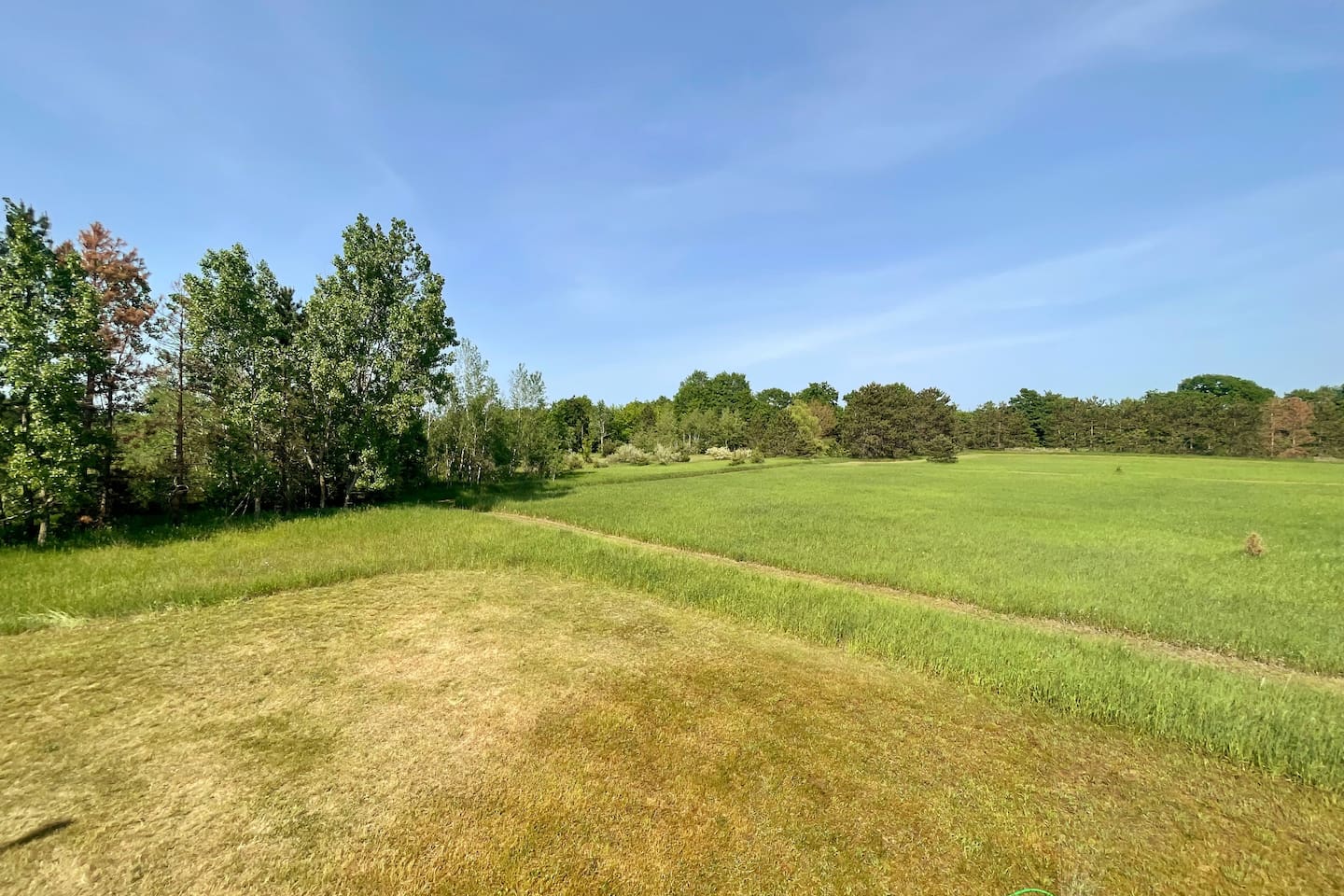 View from patio of walking path leading to Twin Lakes Park/Beach access.