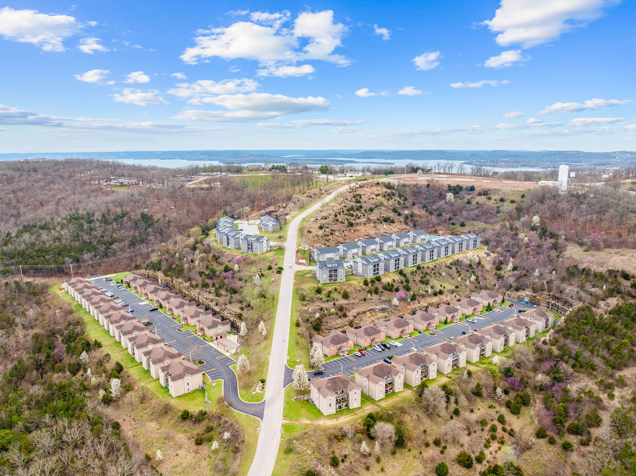 Wide aerial view of the neighborhood and lake
