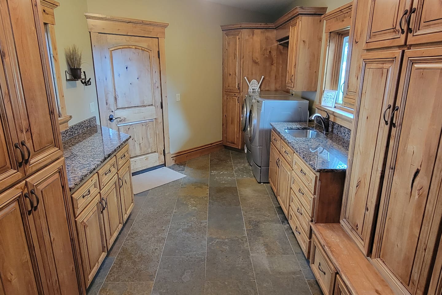 Nobody likes to do laundry, but this laundry room makes it a breeze!  Bonus: we provide the laundry pods, stain removal and other items to help you with your laundry!  

Plus there is plenty of cabinet space!