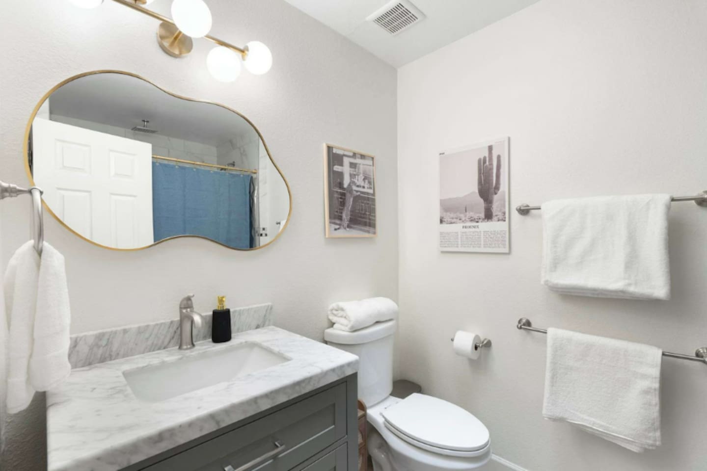 Modern guest bath with marble counters, contemporary fixtures, and designer touches—clean, spa-inspired, and thoughtfully appointed.
