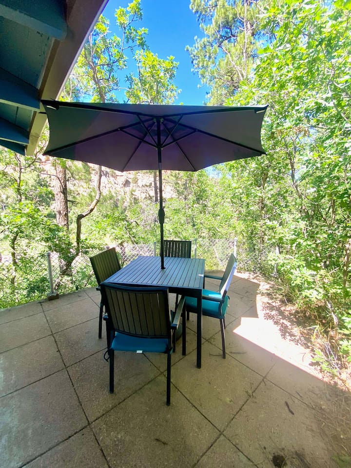 Enjoy meals outside by the gazebo overlooking the cliffside.