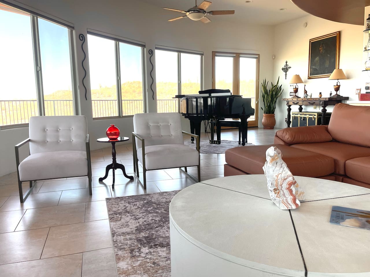 Conversation-friendly seating keeps the living area open and inviting, with the grand piano adding a distinctive touch.