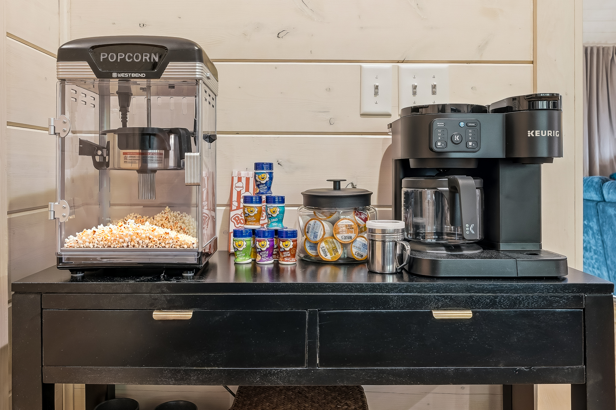 Dedicated coffee and popcorn bar stocked with K cups, flavors, and all the essentials for slow mornings and cozy evenings.
