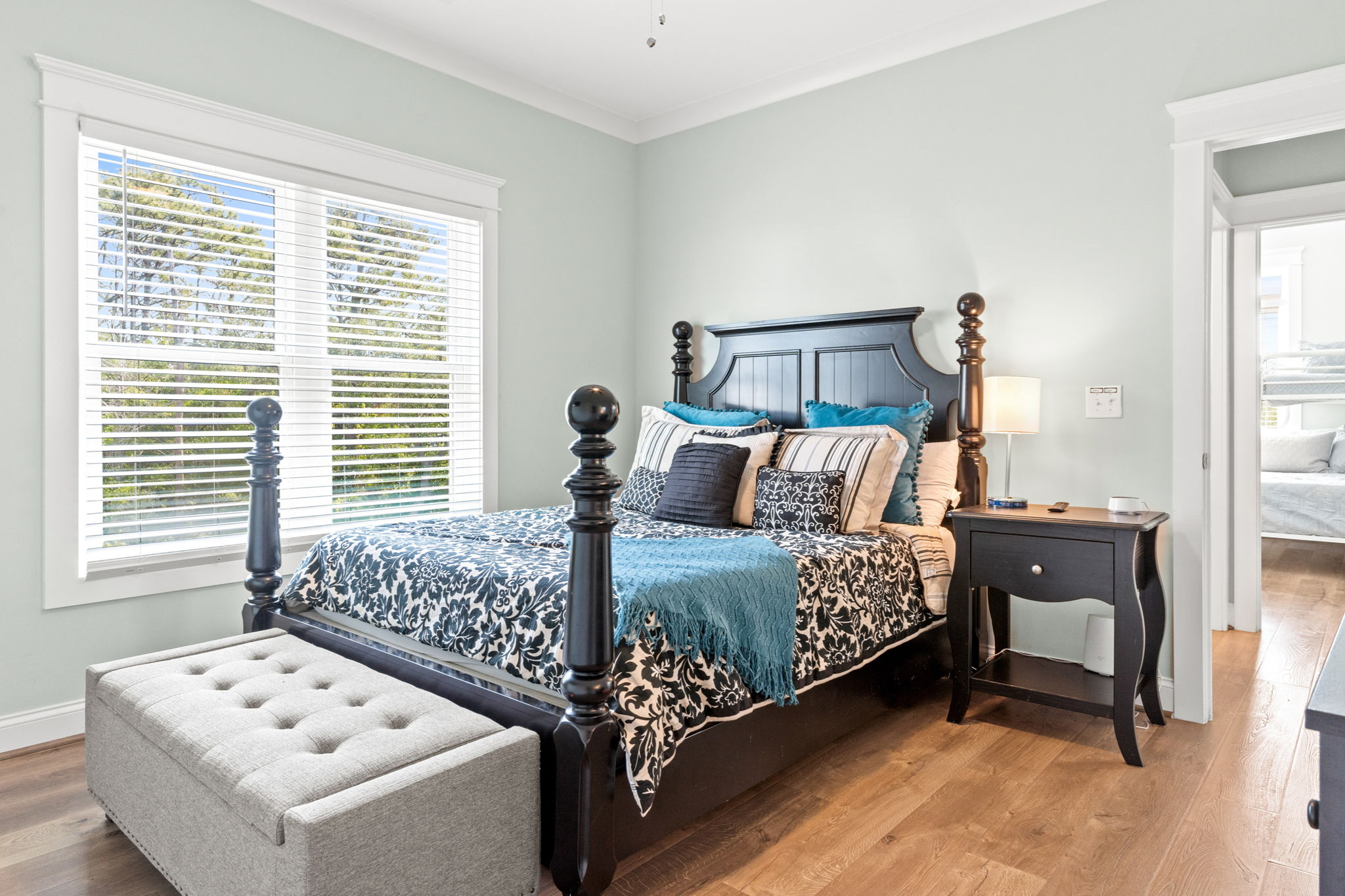Second bedroom with queen mattress, and storage trunk