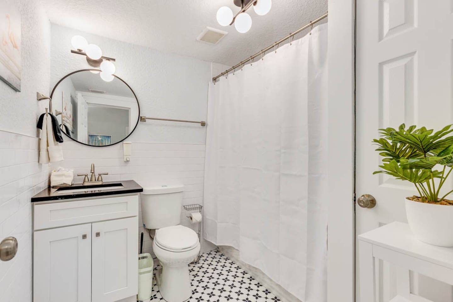 primary bathroom with tub shower combination