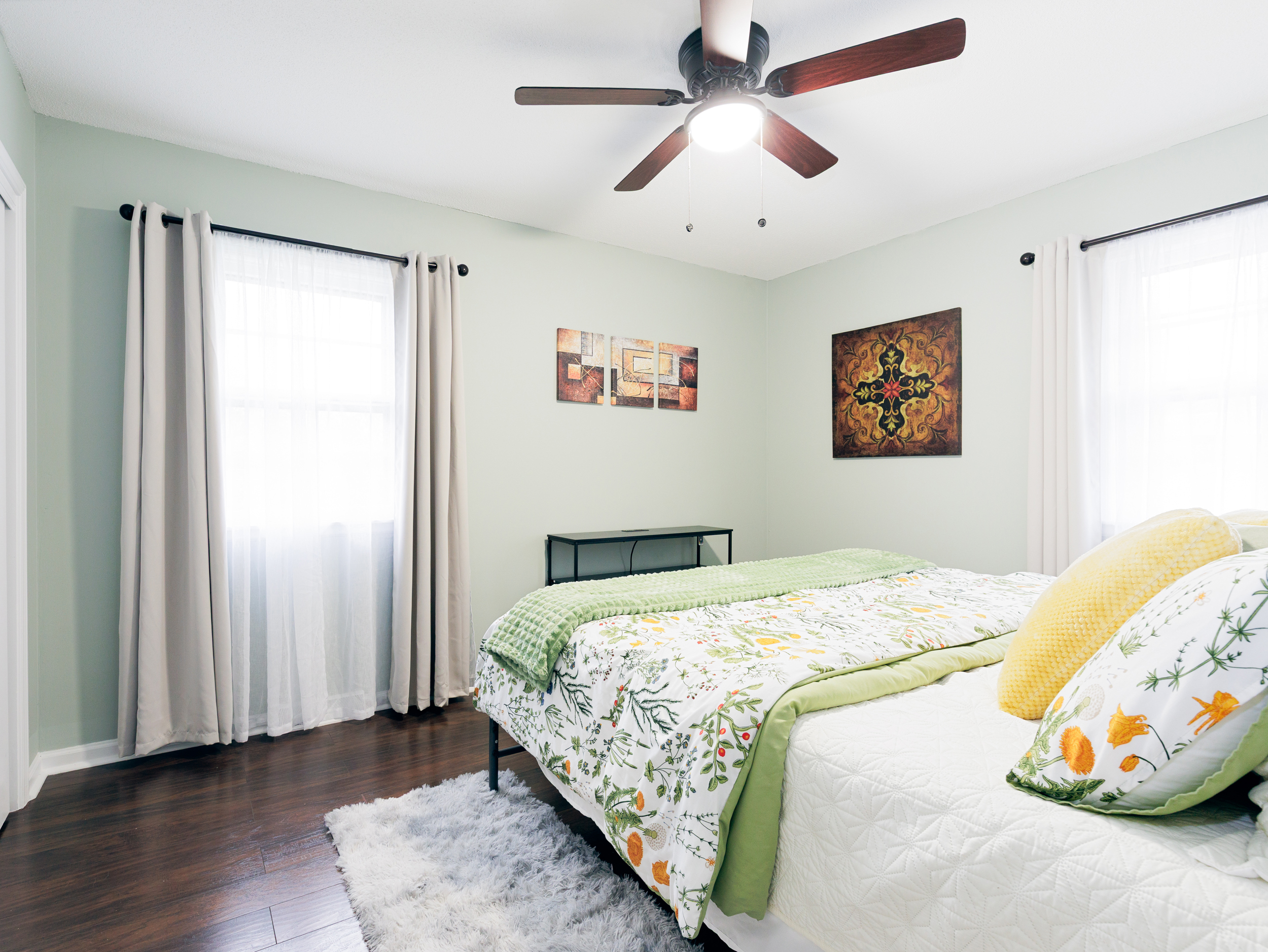 Spacious primary bedroom with king bed, ceiling fan, and a calm, comfortable atmosphere. 50" TV added and shown in next picture.