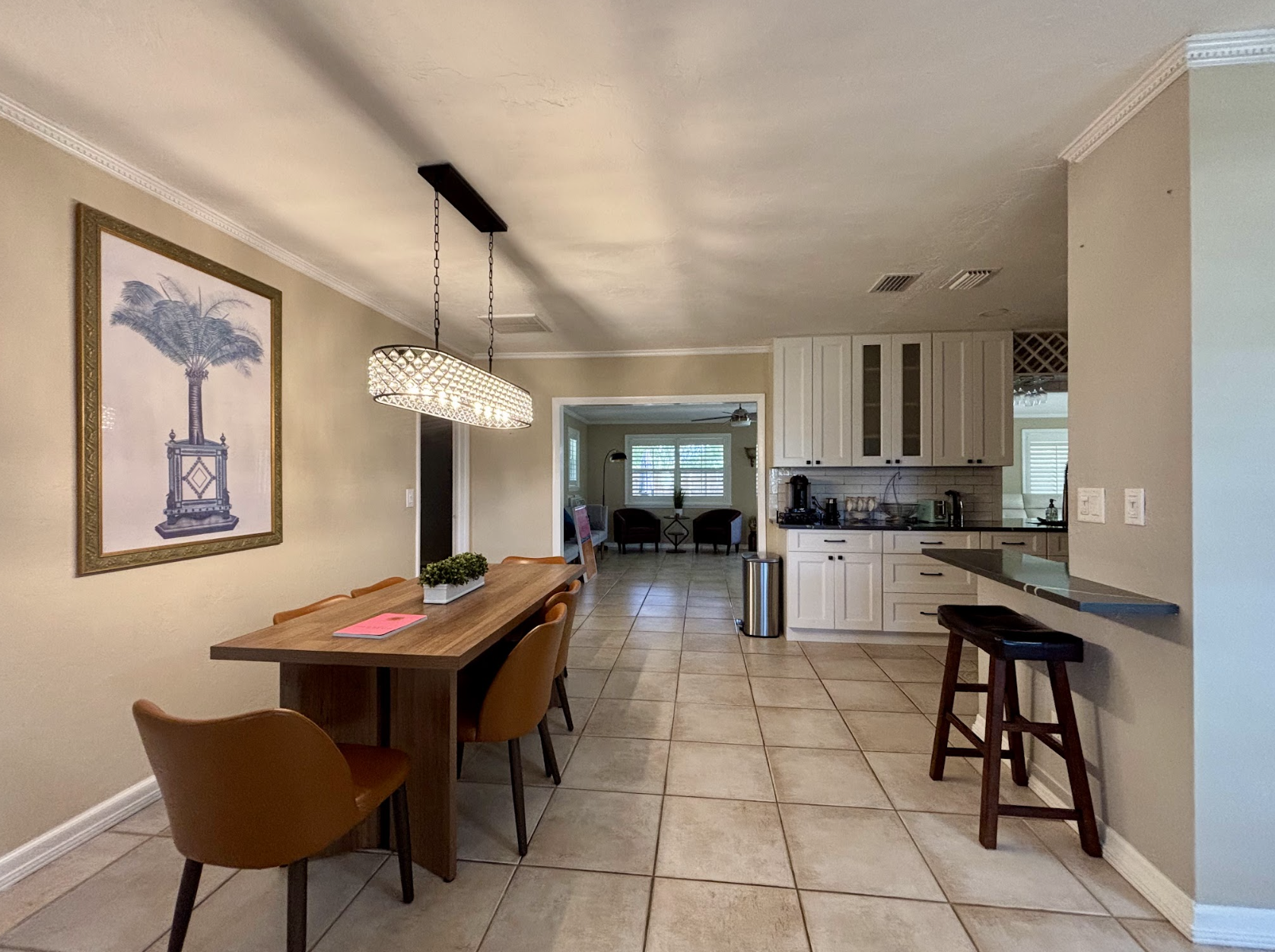 Gather around the table for family meals and games while enjoying the "Old Florida" palm.