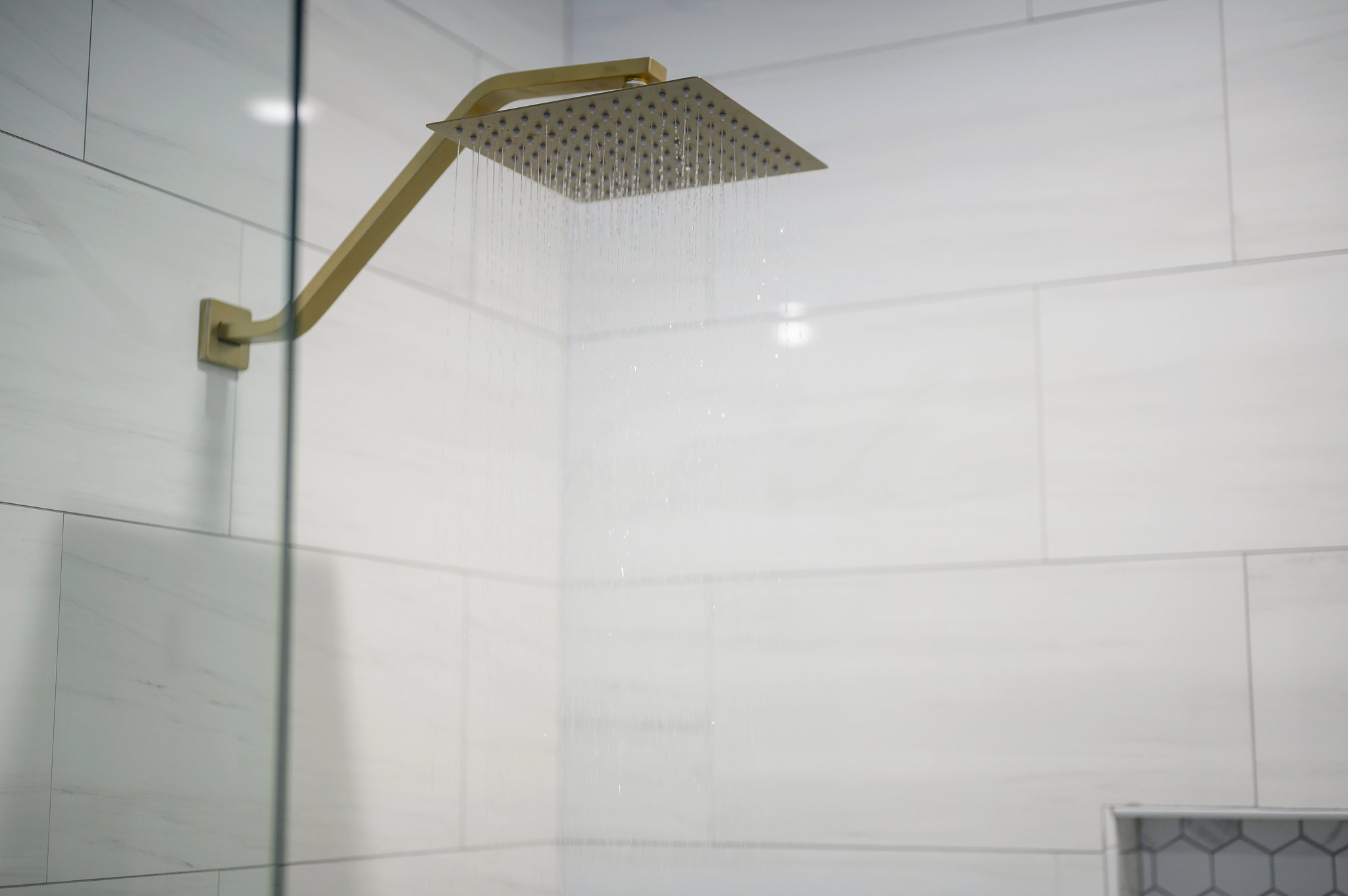 Thoughtful details and upscale fixtures elevate this bathroom into a true retreat.