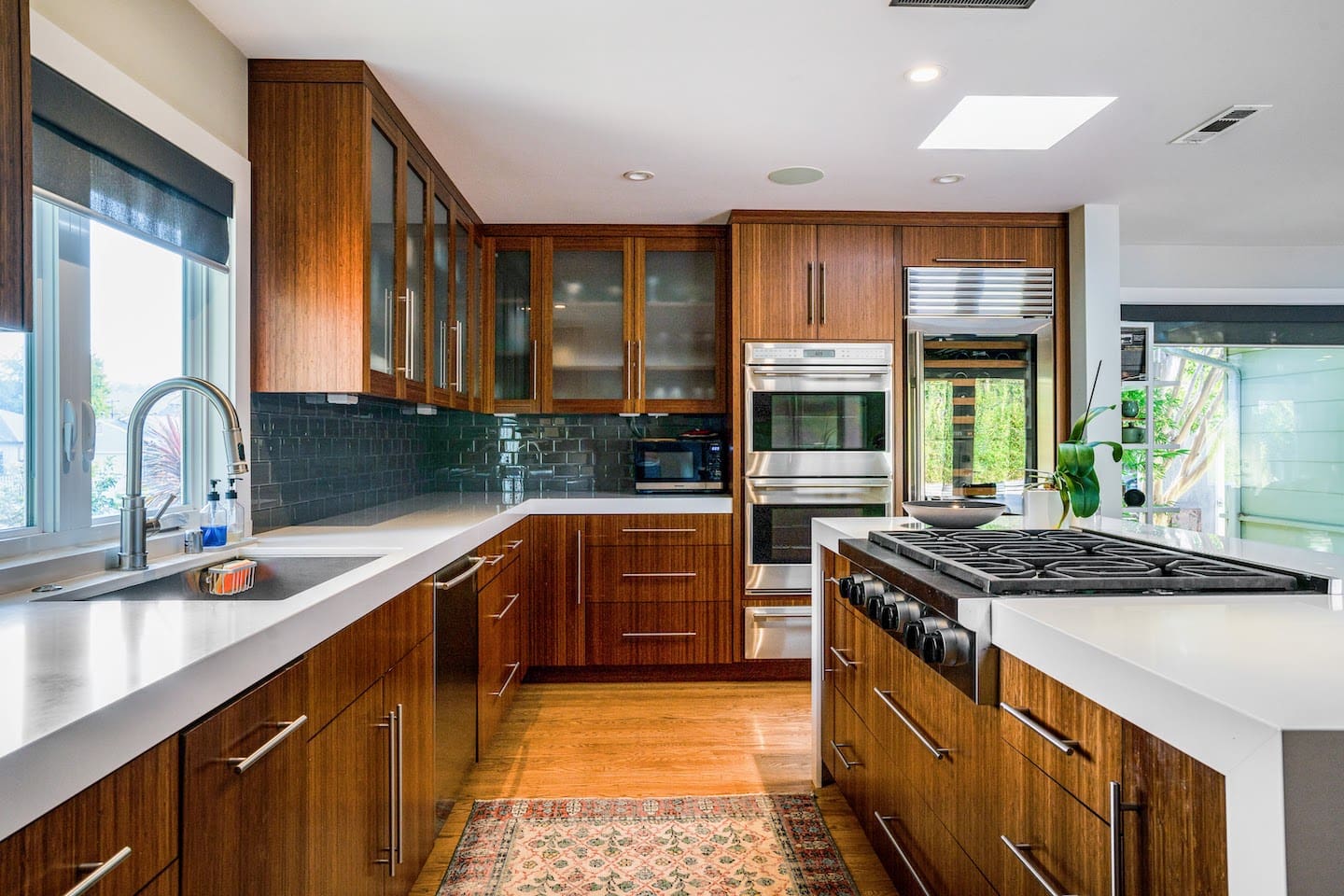 Fully stocked chef's kitchen with 8 person dining table and two person island seating.