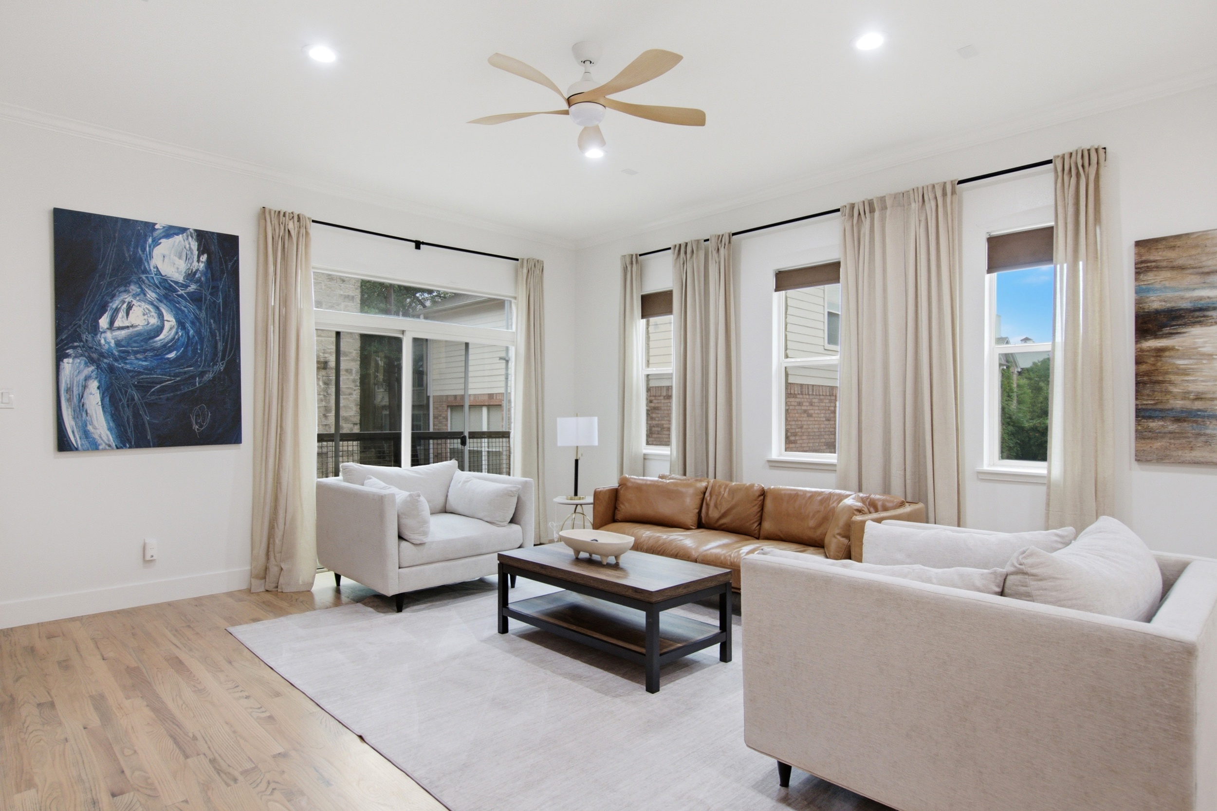 Bright and airy space with modern art, comfy seating, and natural light galore!