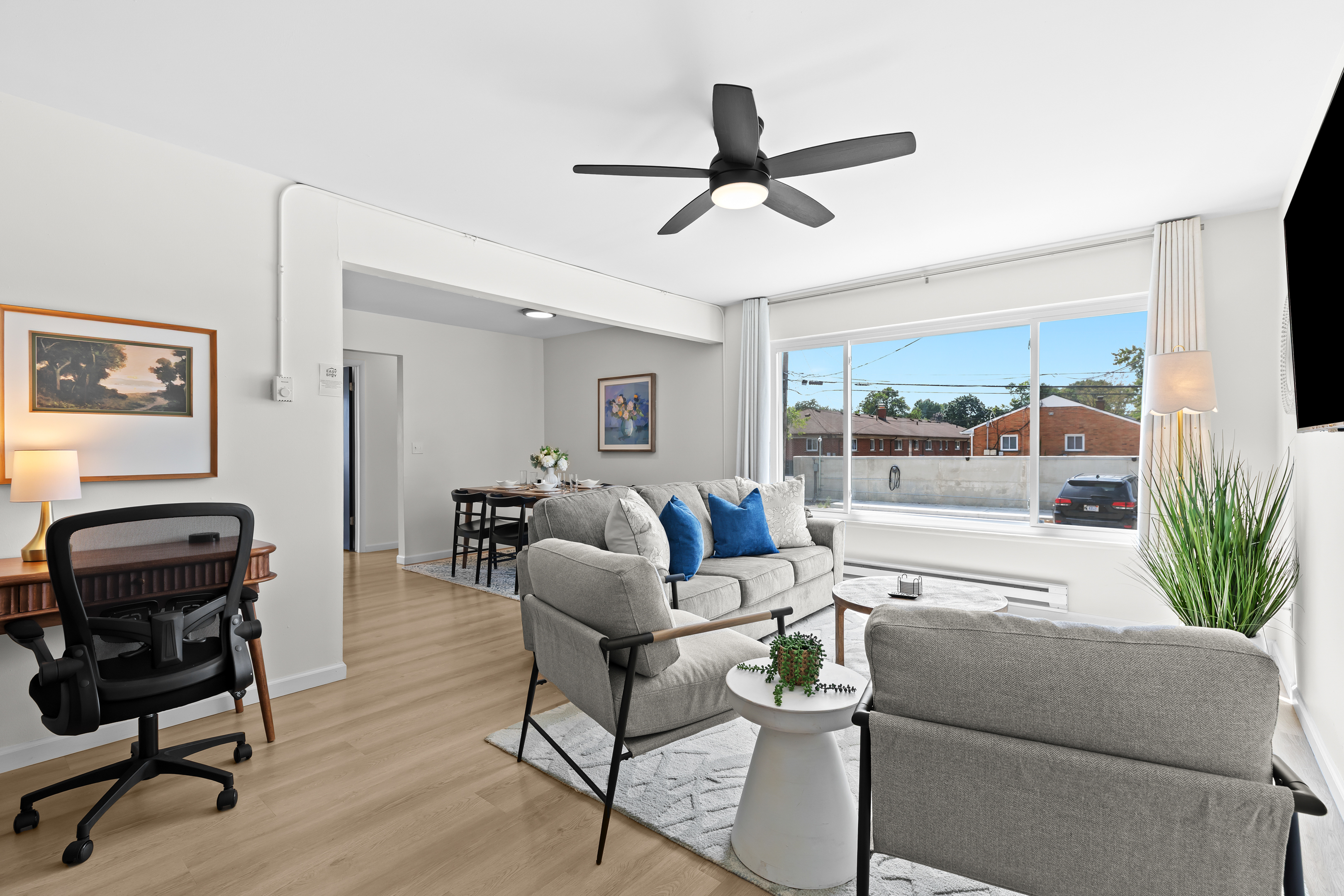 Enjoy a versatile space perfect for both lounging and productivity, complete with a dedicated desk area.