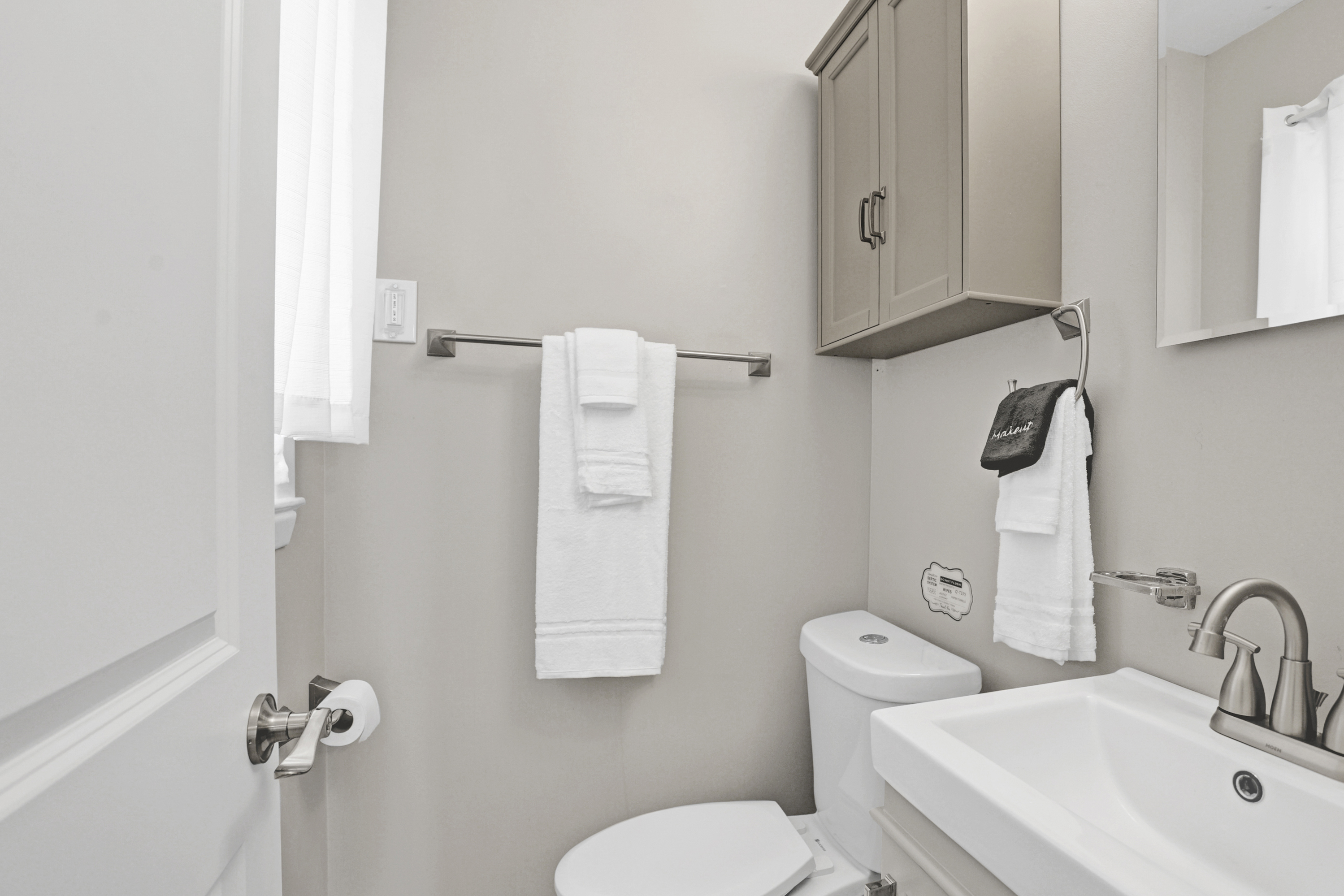 Convenience meets privacy in the ensuite half bath—just steps from the comfort of the king bedroom.