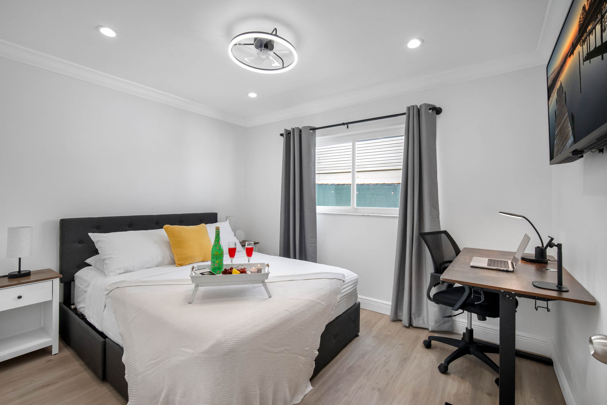 Equipped with a dedicated workspace and comfy bed, this room balances productivity and relaxation beautifully.