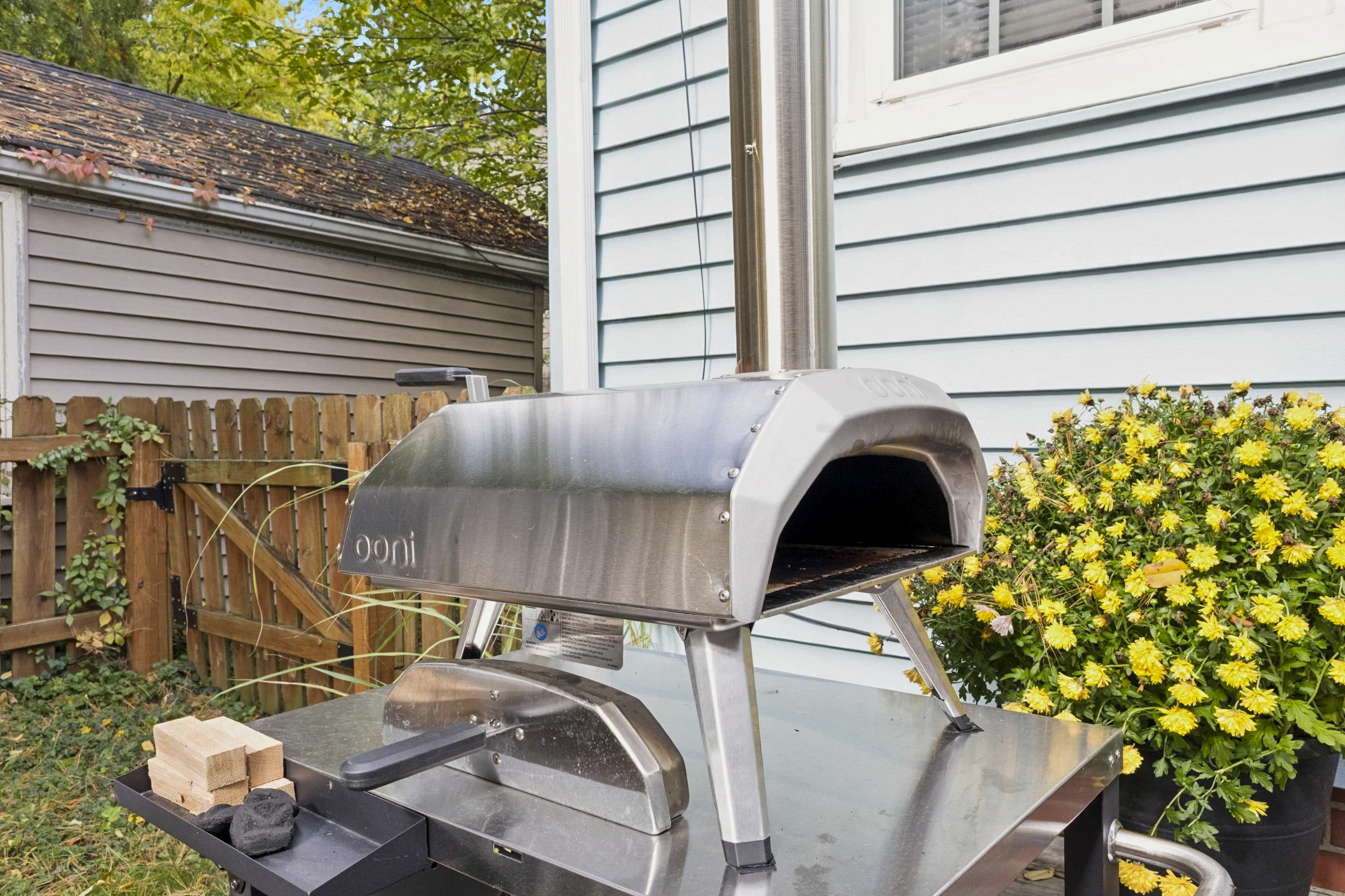 Fire up flavor in our South Bend backyard—pizza oven station with peels, turning tools, and provided wood and charcoal makes alfresco cooking easy. Perfect for cozy nights near Notre Dame.