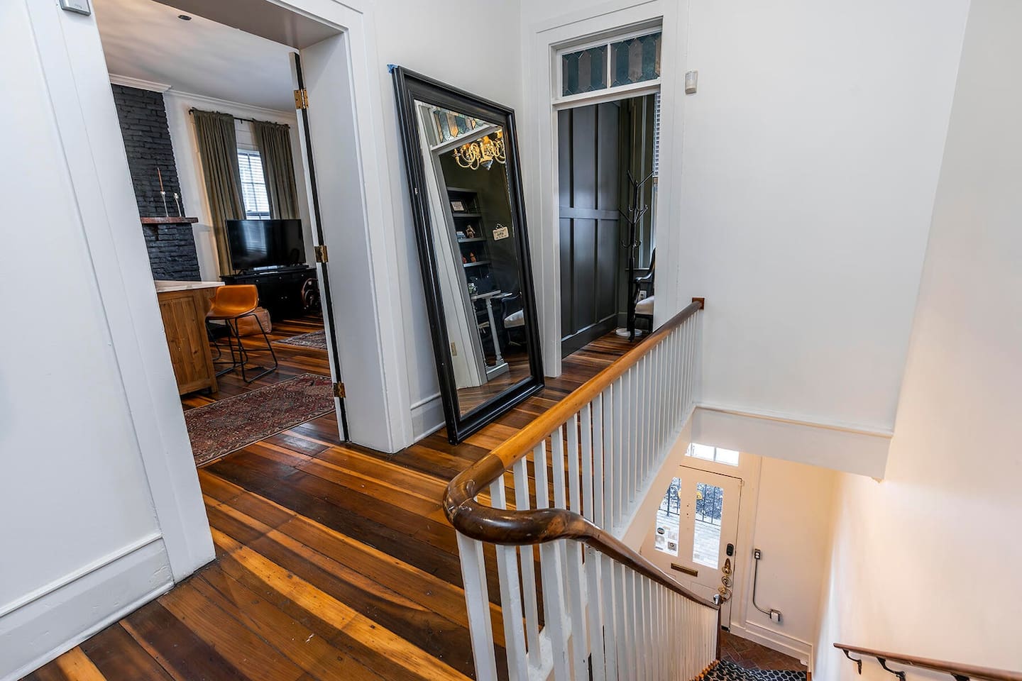 Original handrail and hardwood floors. So much character in this place!