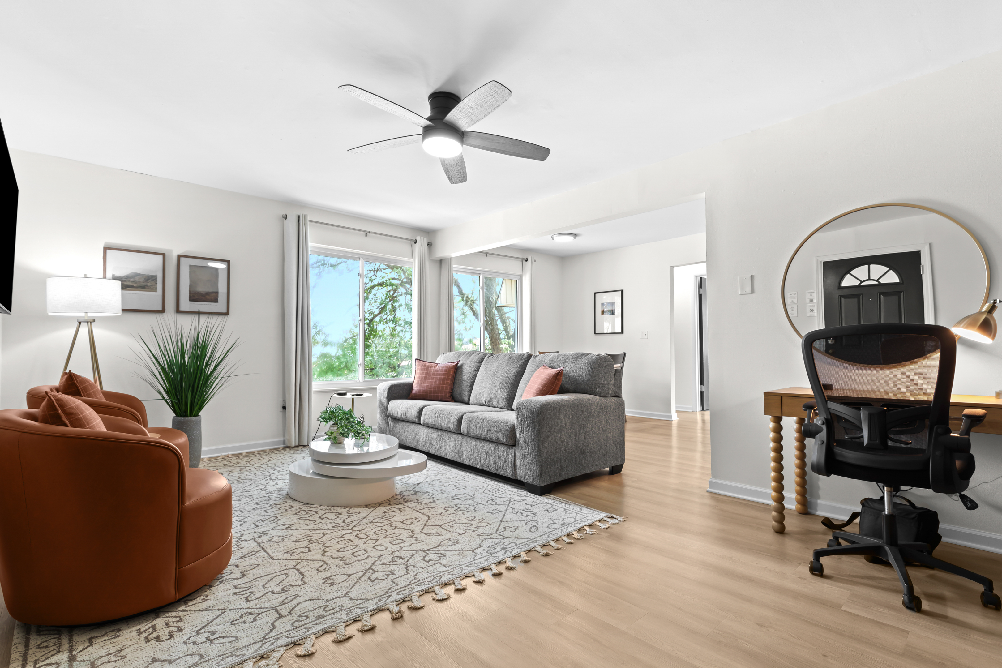 Spacious living room with an integrated workspace for comfort and productivity.