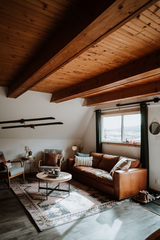 The living room allows for quiet nights and conversation around the record player or smart TV