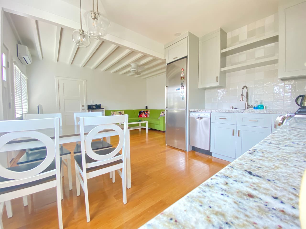 Open kitchen and dining area with vaulted ceilings and great light.