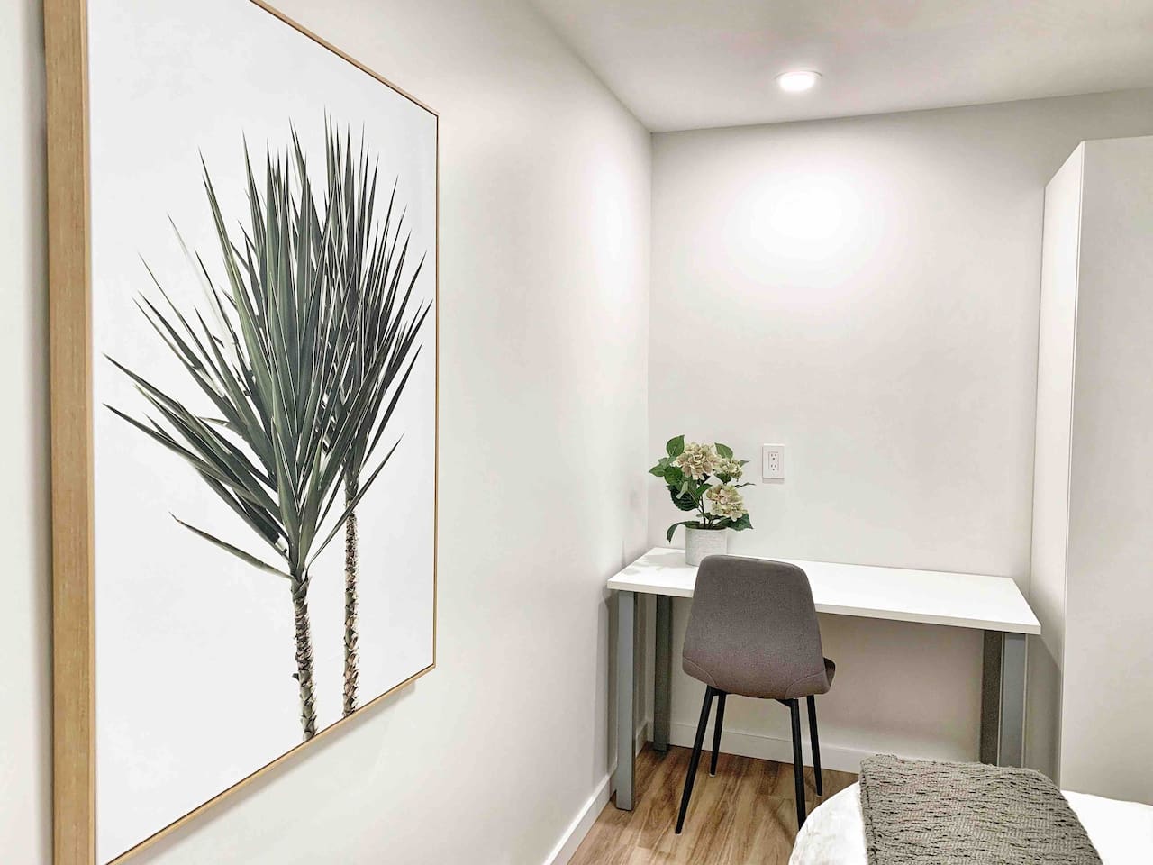 Dedicated workspace located in the primary bedroom with desk and chair.