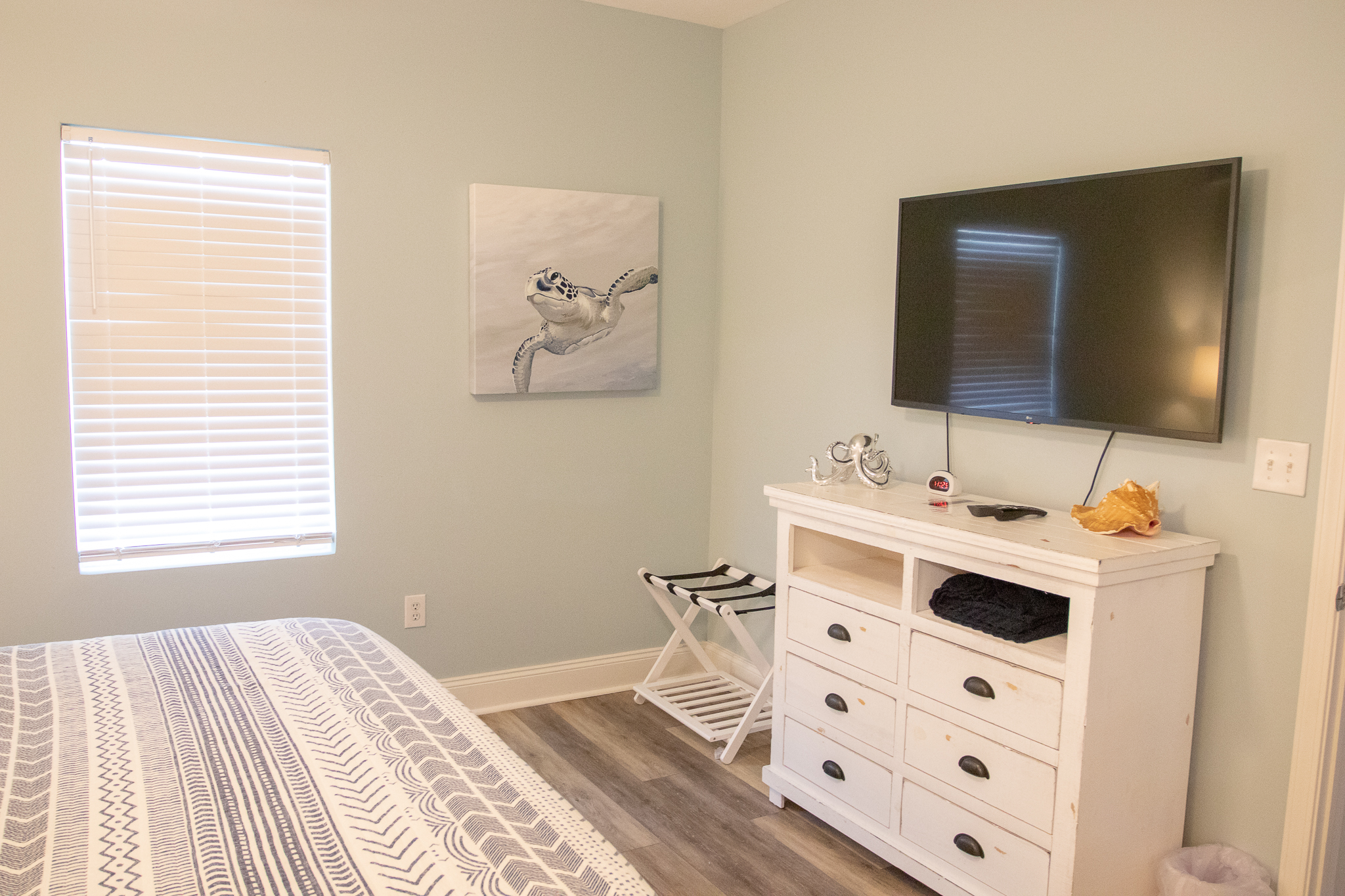 tv and dresser in the 2nd bedroom