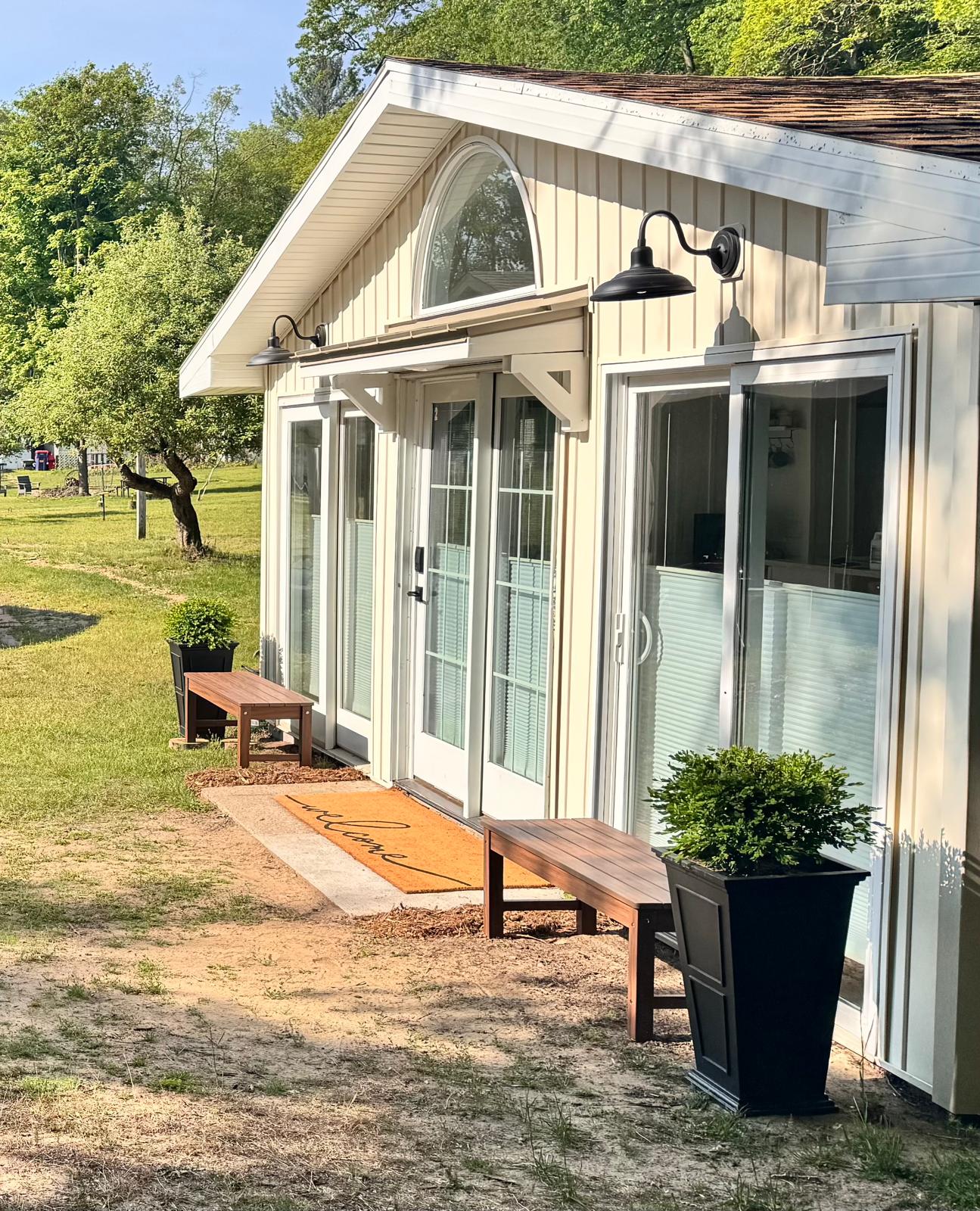 Wake up to beautiful views and golden hour glows. This charming home offers a private, peaceful setting with plenty of natural light and outdoor benches for soaking in the air. Features easy keyless entry for a smooth, contact-free arrival. 