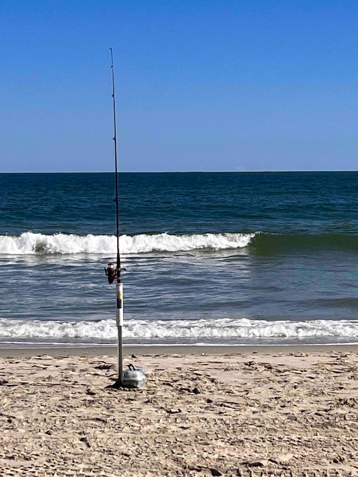 Standing on the beach with toes in the sand and a few lines in the water is a great way to spend a few days in Corolla.
