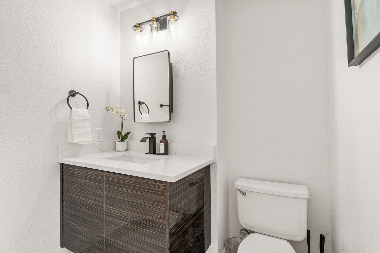 Clean and modern bathroom with updated fixtures and premium bath products.