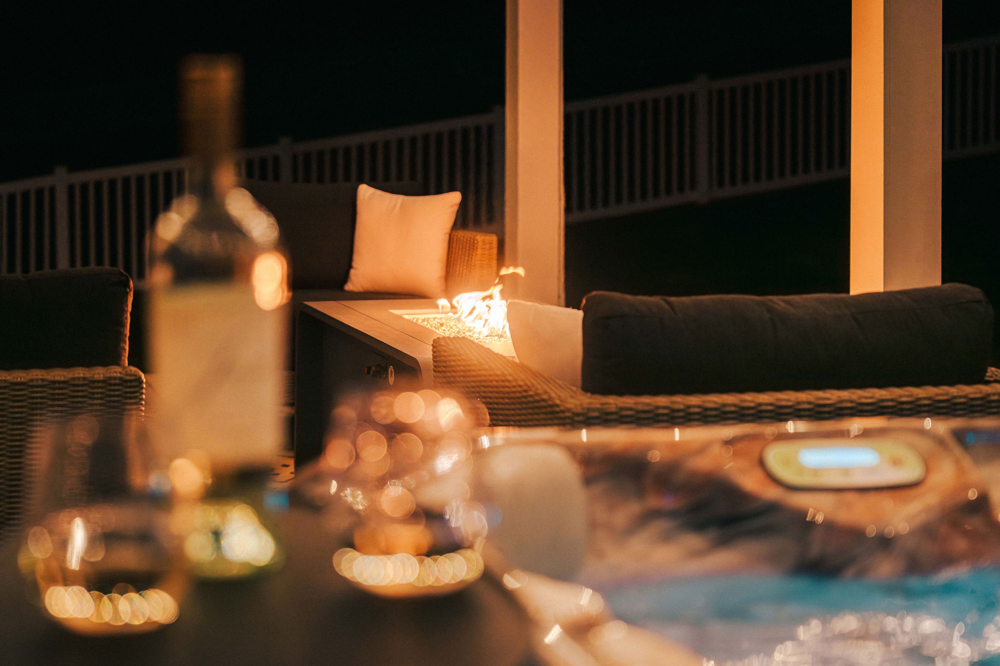 Evenings made better with the hot tub and nearby fire feature for warmth and ambiance