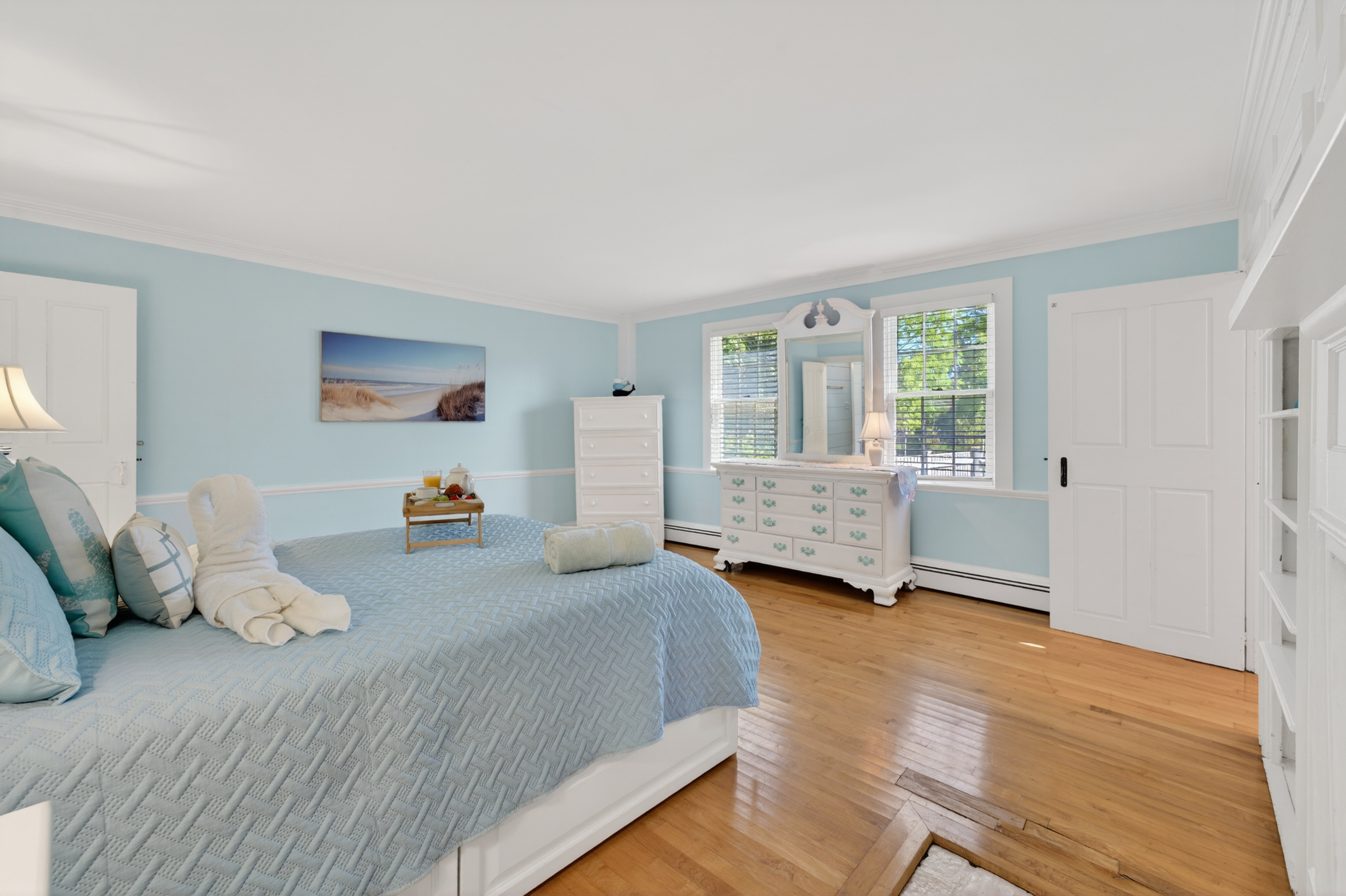 Wake up refreshed in the inviting primary bedroom, thoughtfully designed with comfort and style in mind.