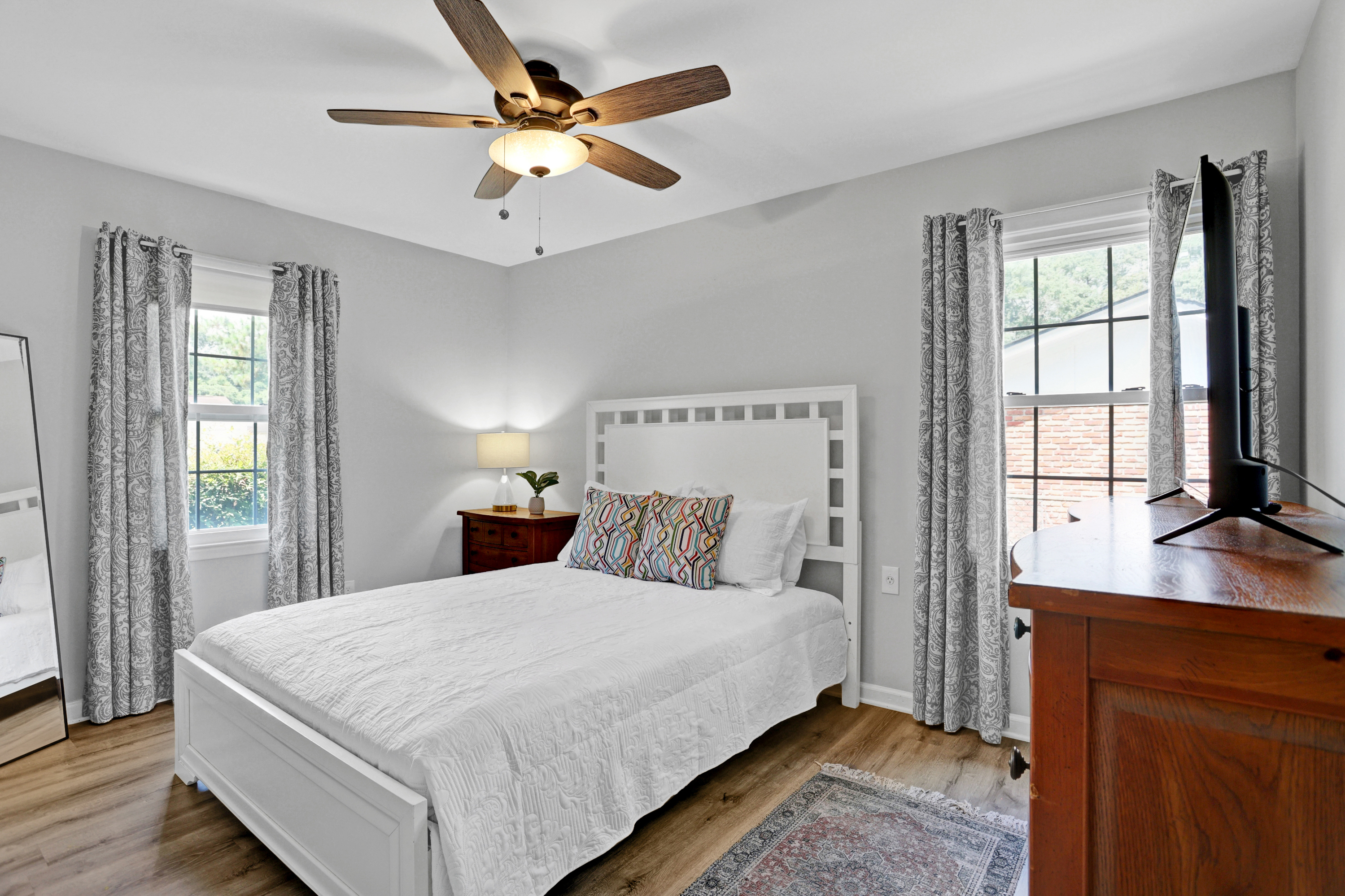 Charming and cozy, the queen bedroom offers a restful retreat with soft linens, calming colors, and a touch of Southern style.
