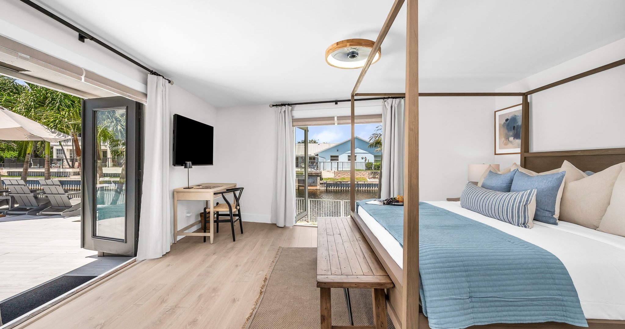 The primary king suite feels like your own private resort—featuring panoramic views of the pool and lake, seamless indoor-outdoor flow, and a newly renovated spa-inspired ensuite. Thoughtfully styled with designer finishes.