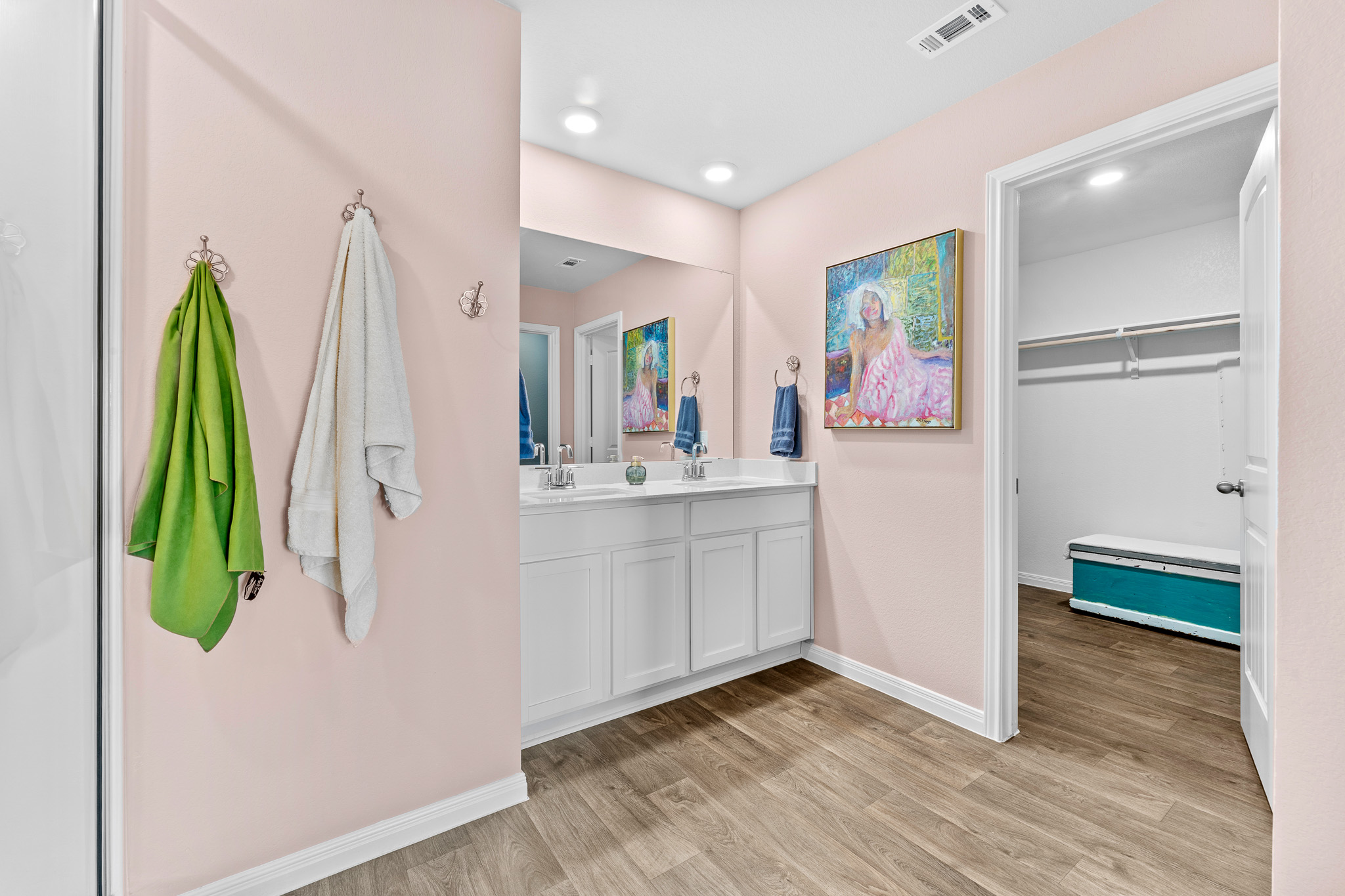 The master bath leads to a huge walk in closet and dressing room