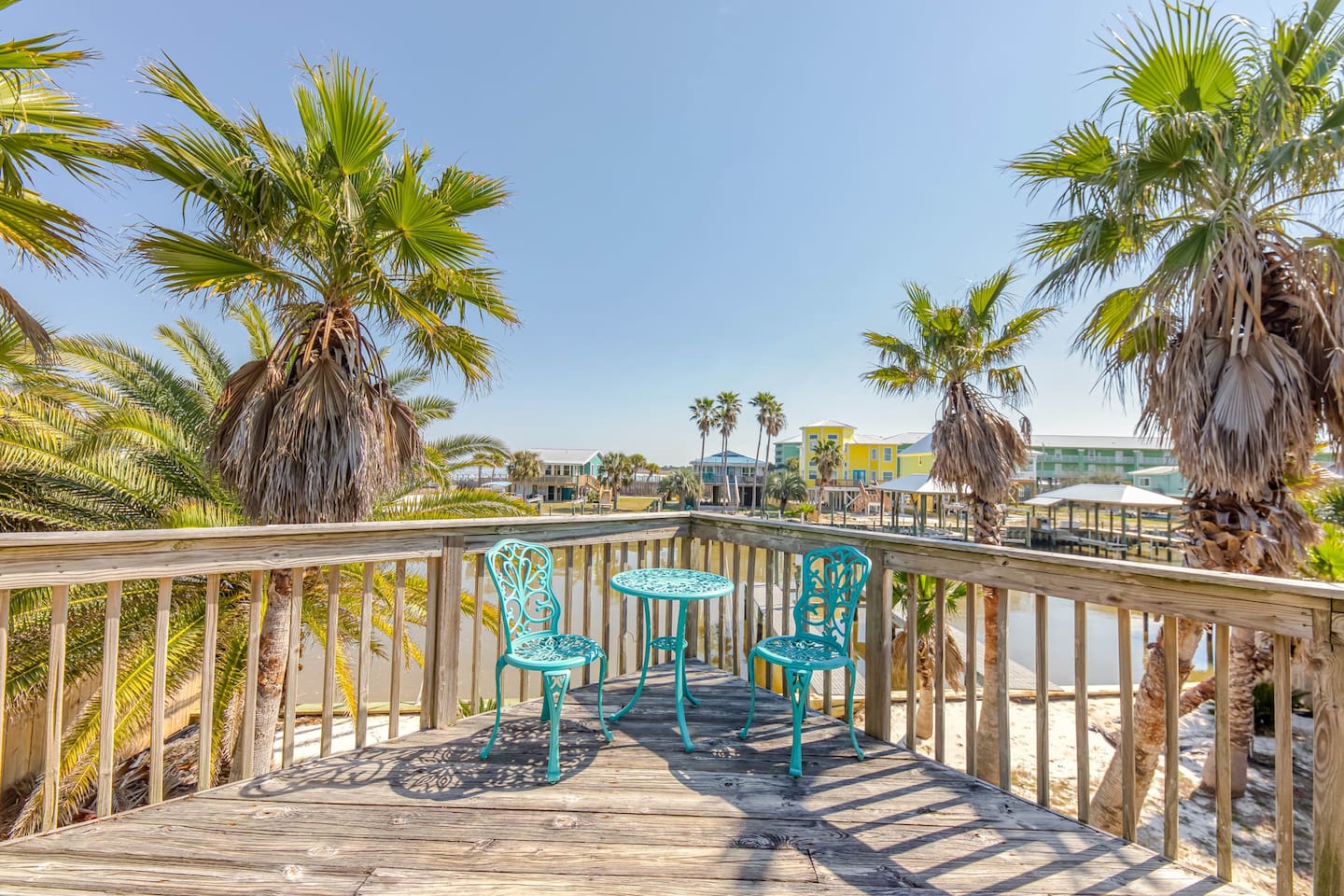 Private Deck Retreat: Sip coffee with a view of palm trees and calm waters—your escape awaits!