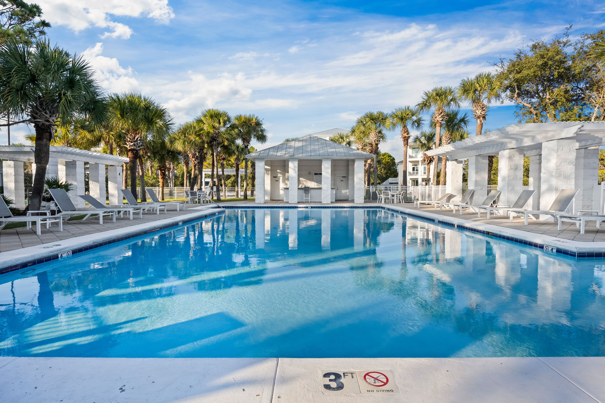 Straight out the front door and just a short walk down to Osprey Circle, this larger neighborhood pool offers lounge seating, beautiful landscaping, and a bath/changing area—often a quiet, easy getaway just steps from the house when you want a little spac