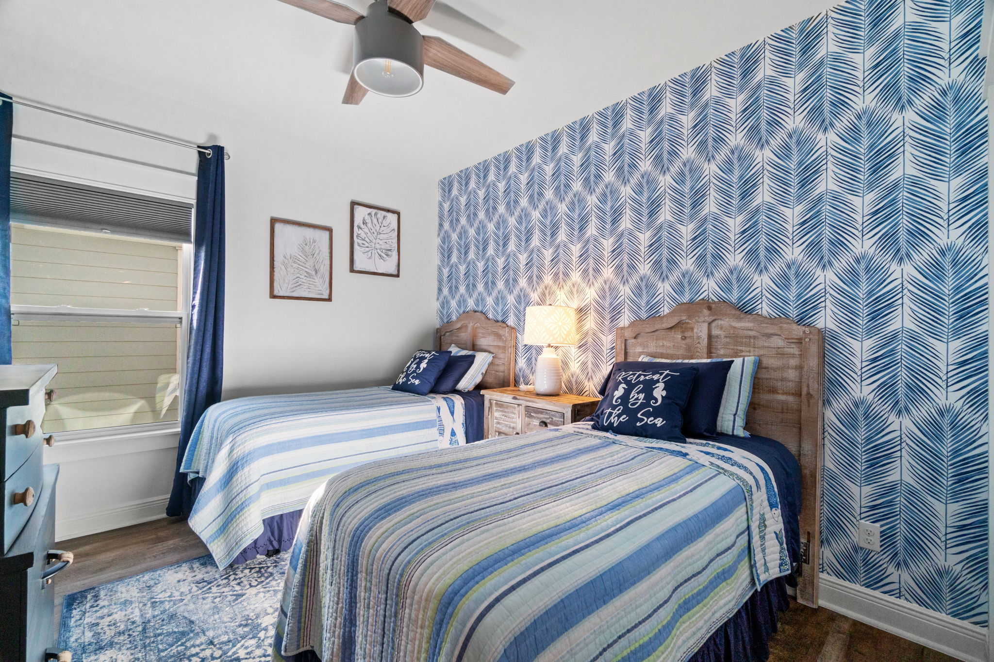 Guest room with set of twins, perfect for either kids or adults! Memory foam toppers and blackout shades and curtains allow for dreamy sleep