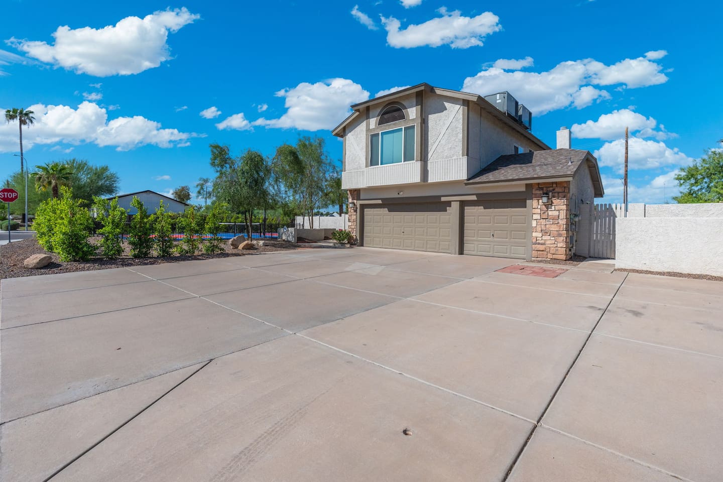 Space to spare — the expansive driveway welcomes multiple vehicles with ease.