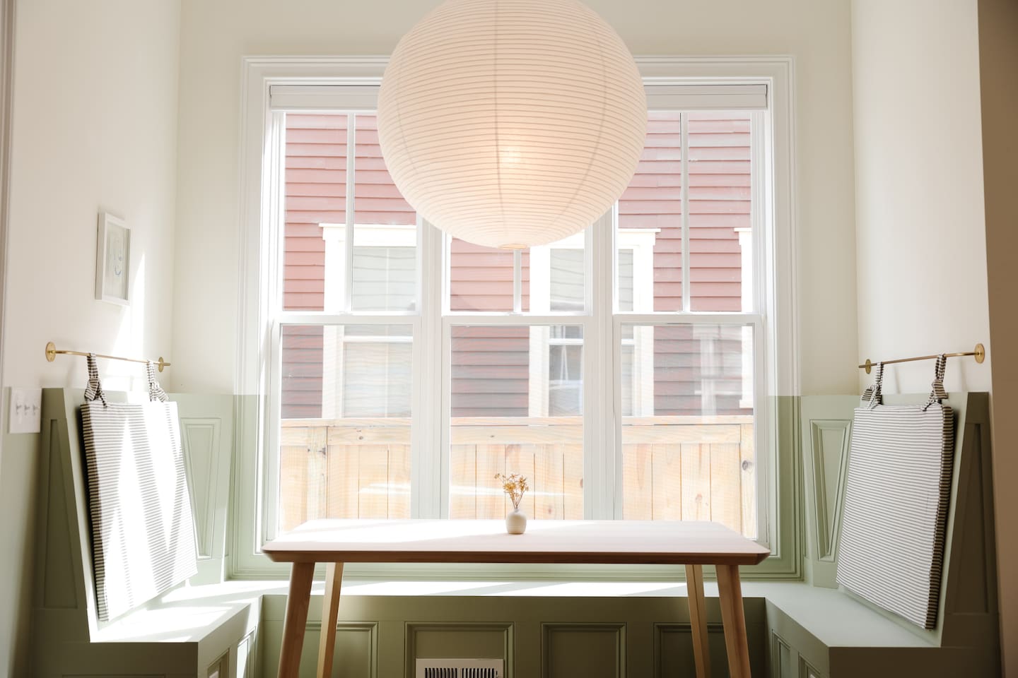 The breakfast nook may be our favorite part of the house. Featuring custom cushions and the oversized rice paper lantern from Hay. It's a great place to share a coffee or take a meeting.