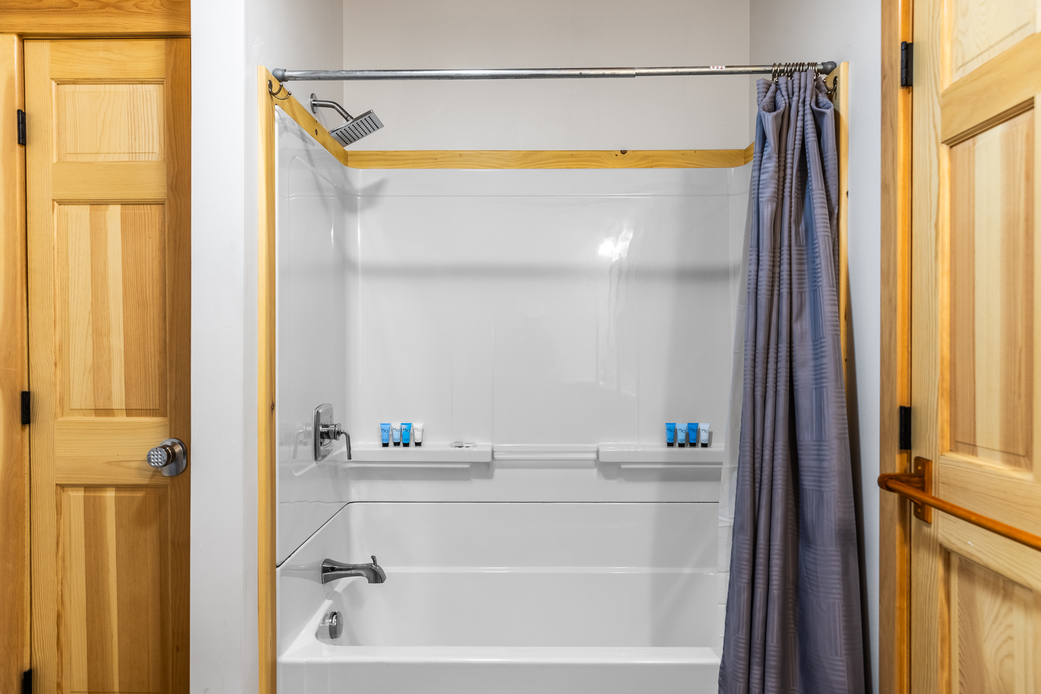 Full bathroom with washer and dryer