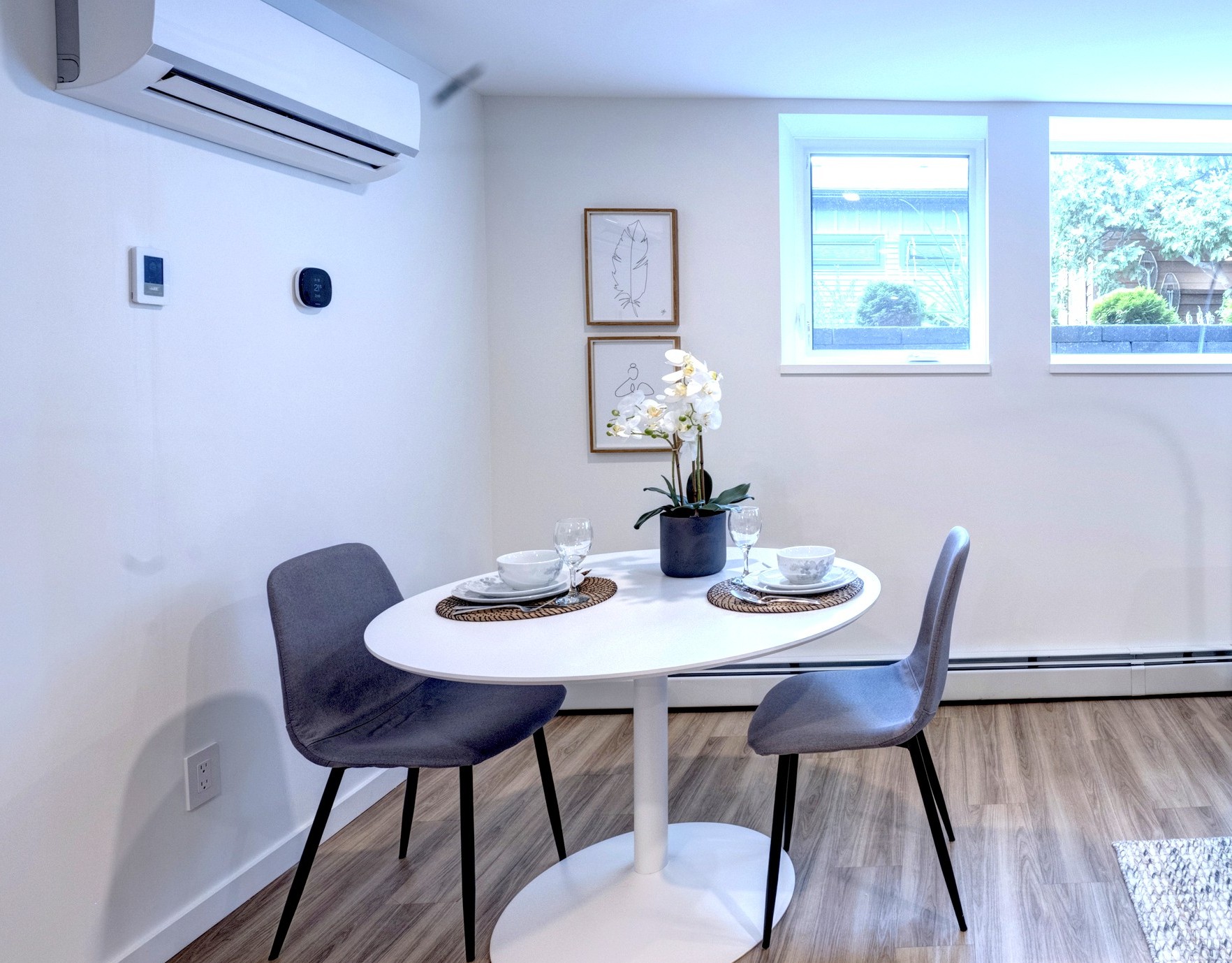 Dining area with seating for two — ideal for meals, coffee, or planning the day.