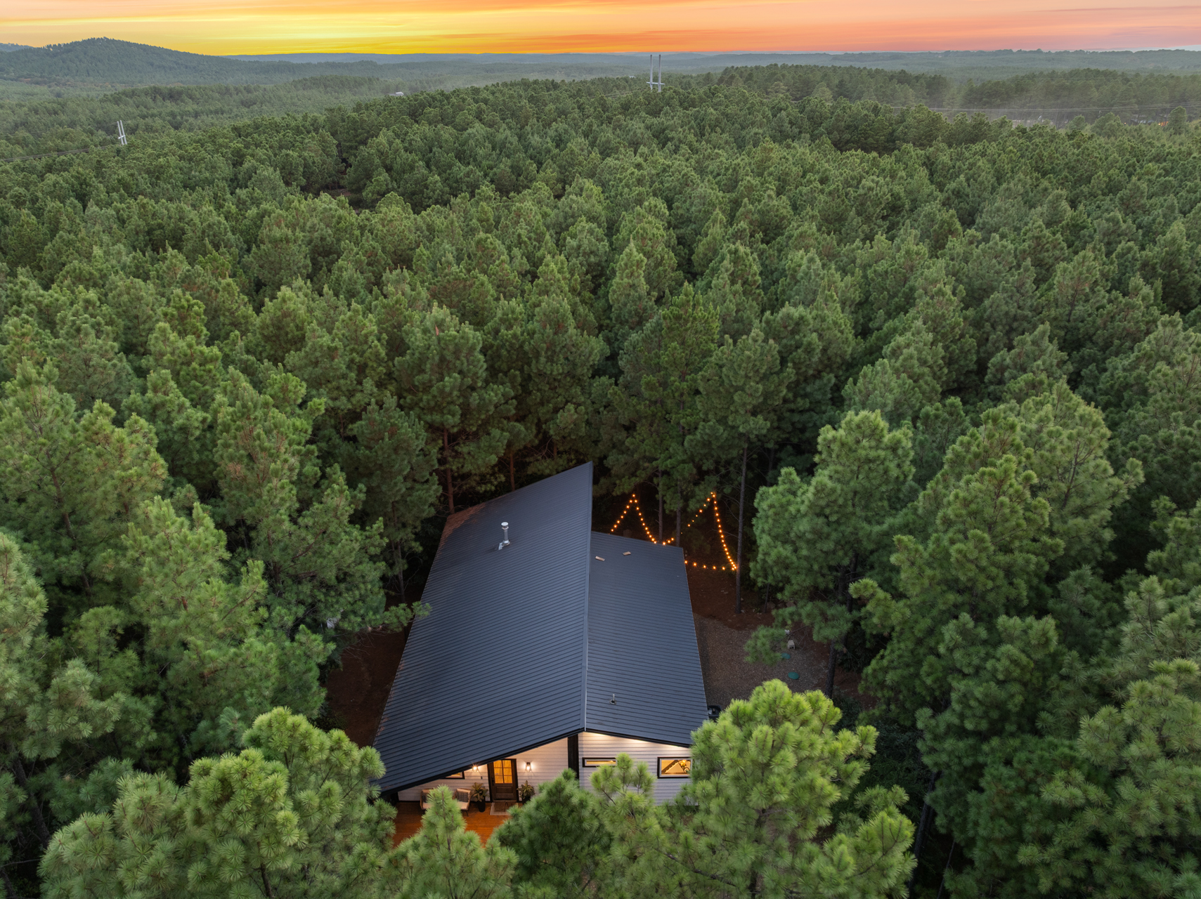 From above, you can see what makes Cedar Stillness so special: a peaceful little cabin tucked deep into the pines, with nothing but forest wrapping around you.