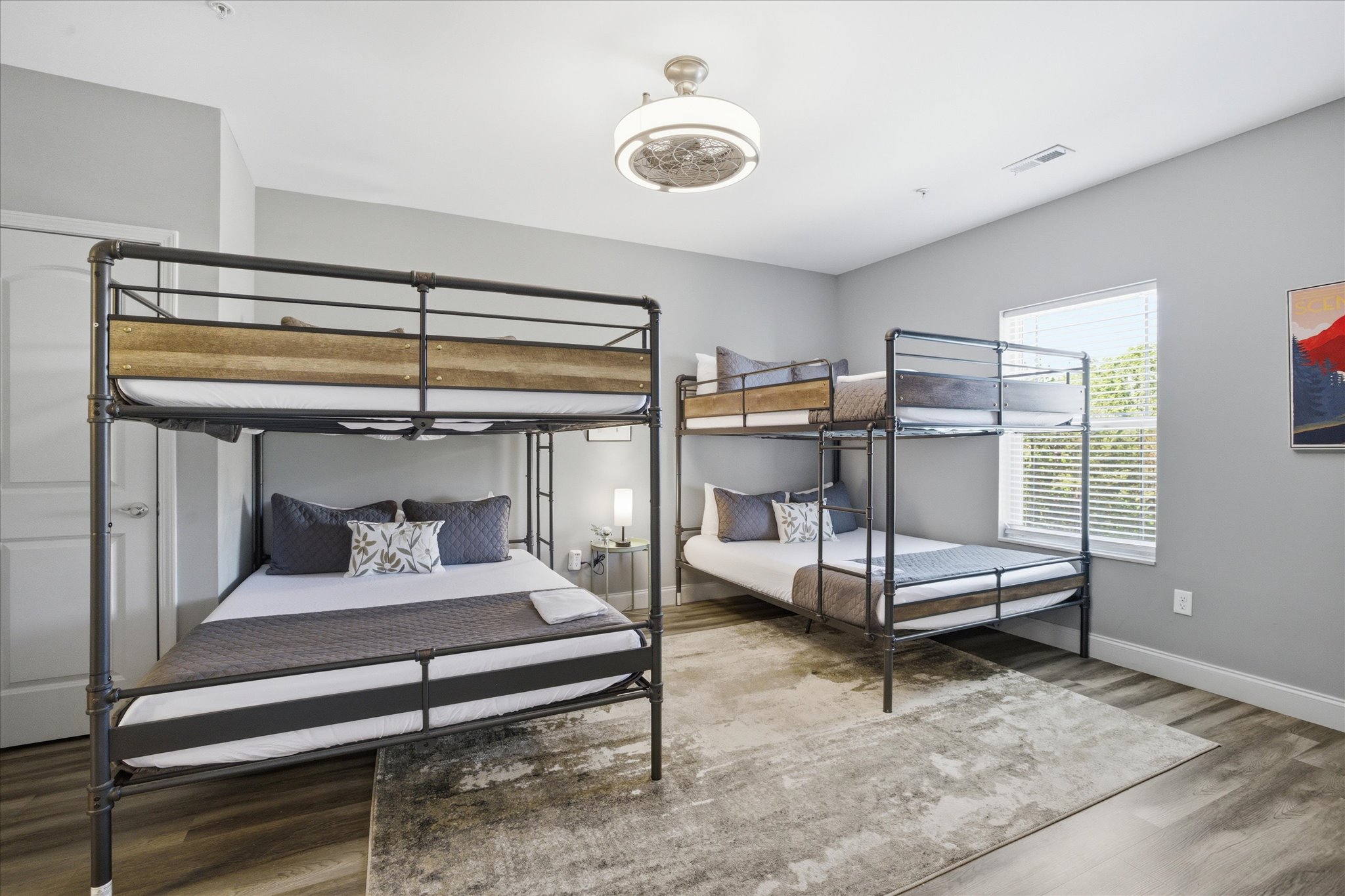 Let this be the late-night hangout zone—movies playing, snacks passed around, and plenty of room for everyone to spread out. With a TV in the room and cozy bedding all around, it’s built for winding down together.