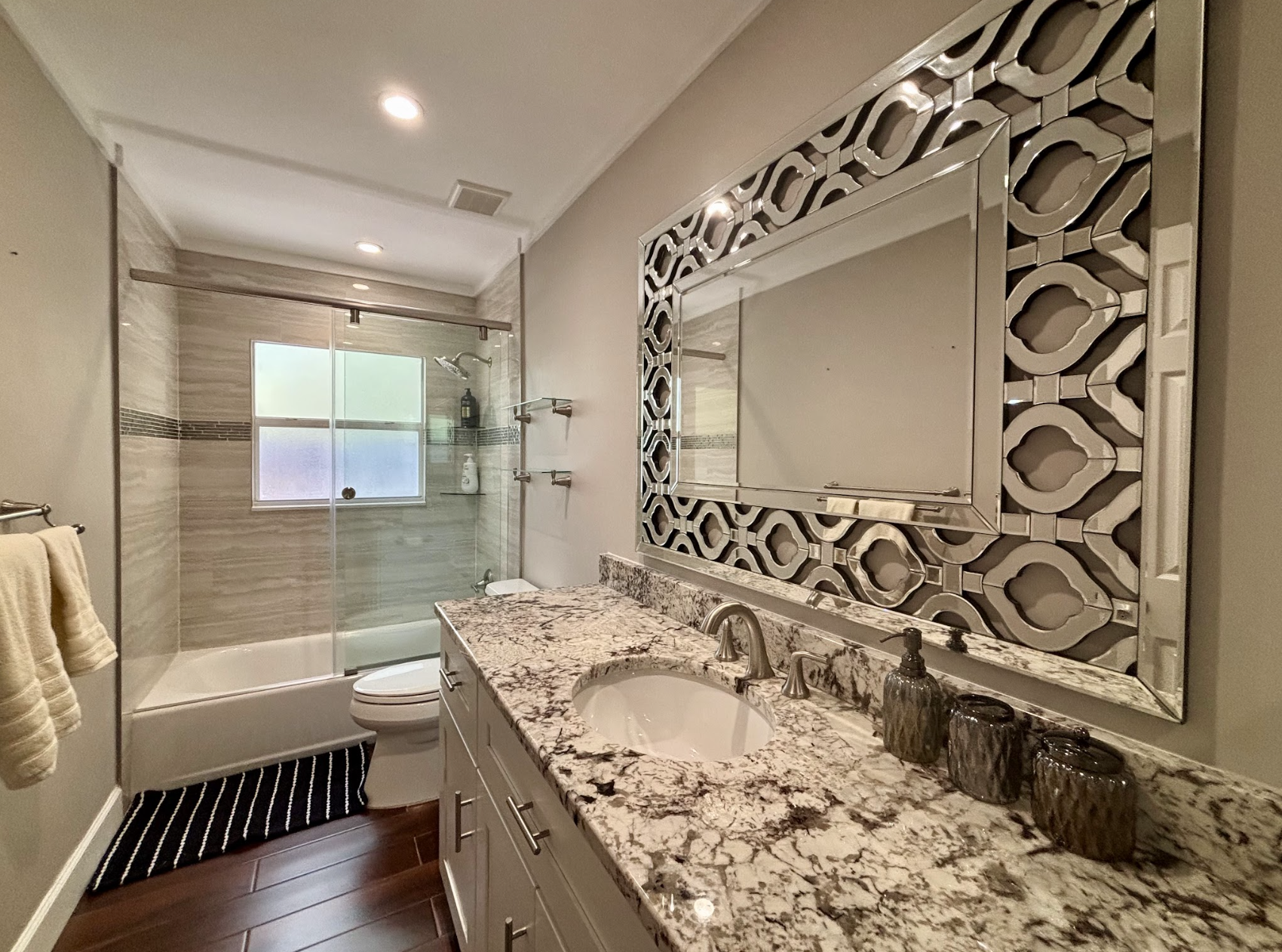 The second restroom is located between the other two bedrooms.