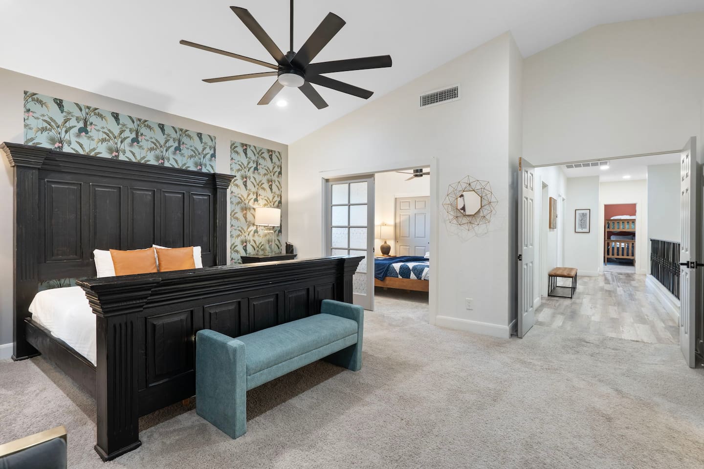 A striking retreat with bold design, opening onto a hallway of connected suites.