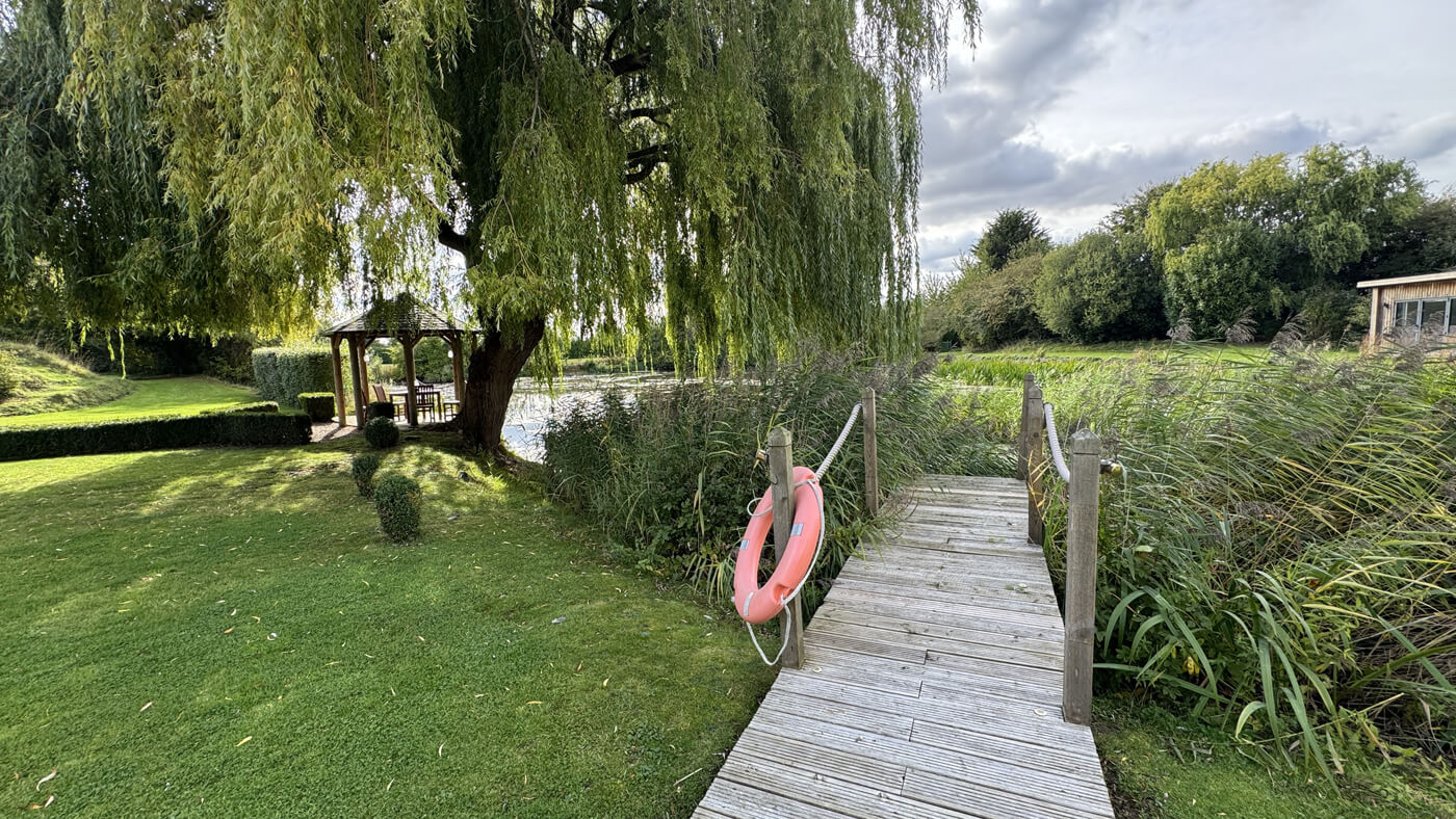 Main House Lake and pergola dining