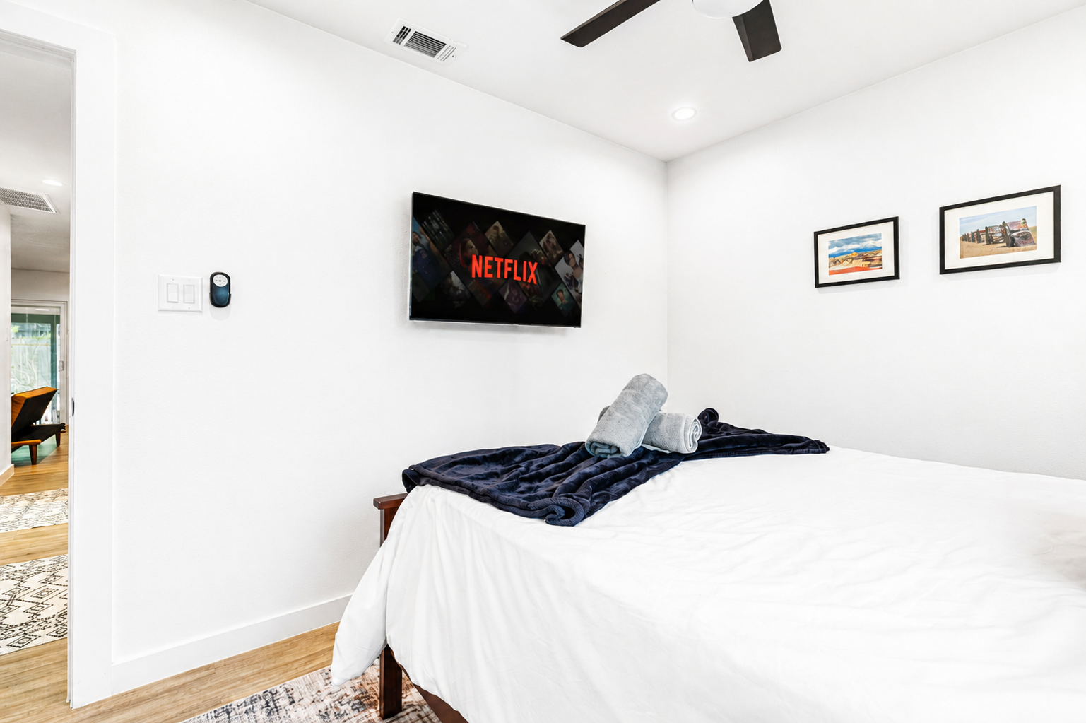 Enjoy movie nights with Netflix on the wall-mounted TV and plush bedding!
