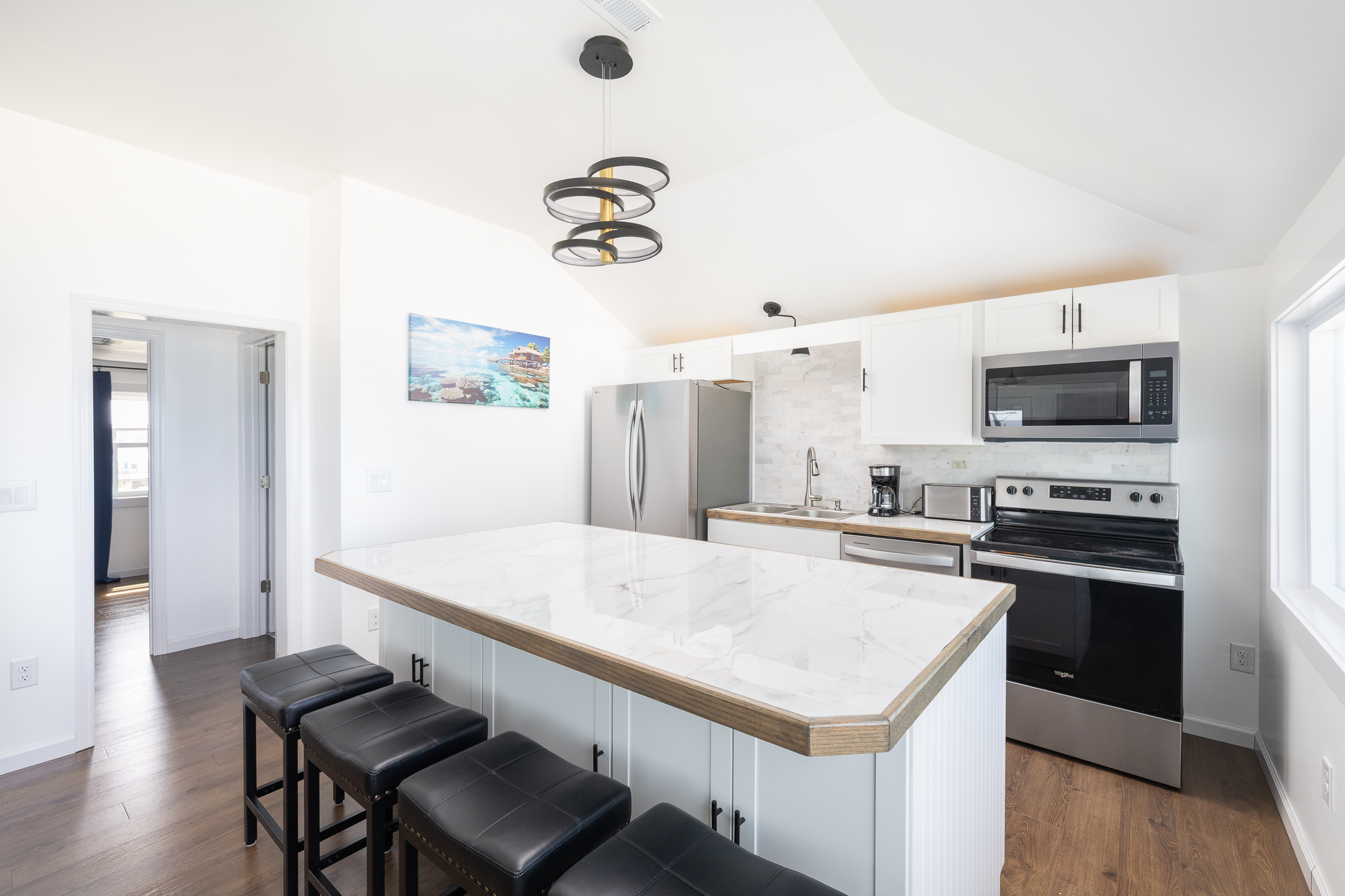 Great Room - Kitchen Island & Entrance to 2nd Floor NW Bedroom