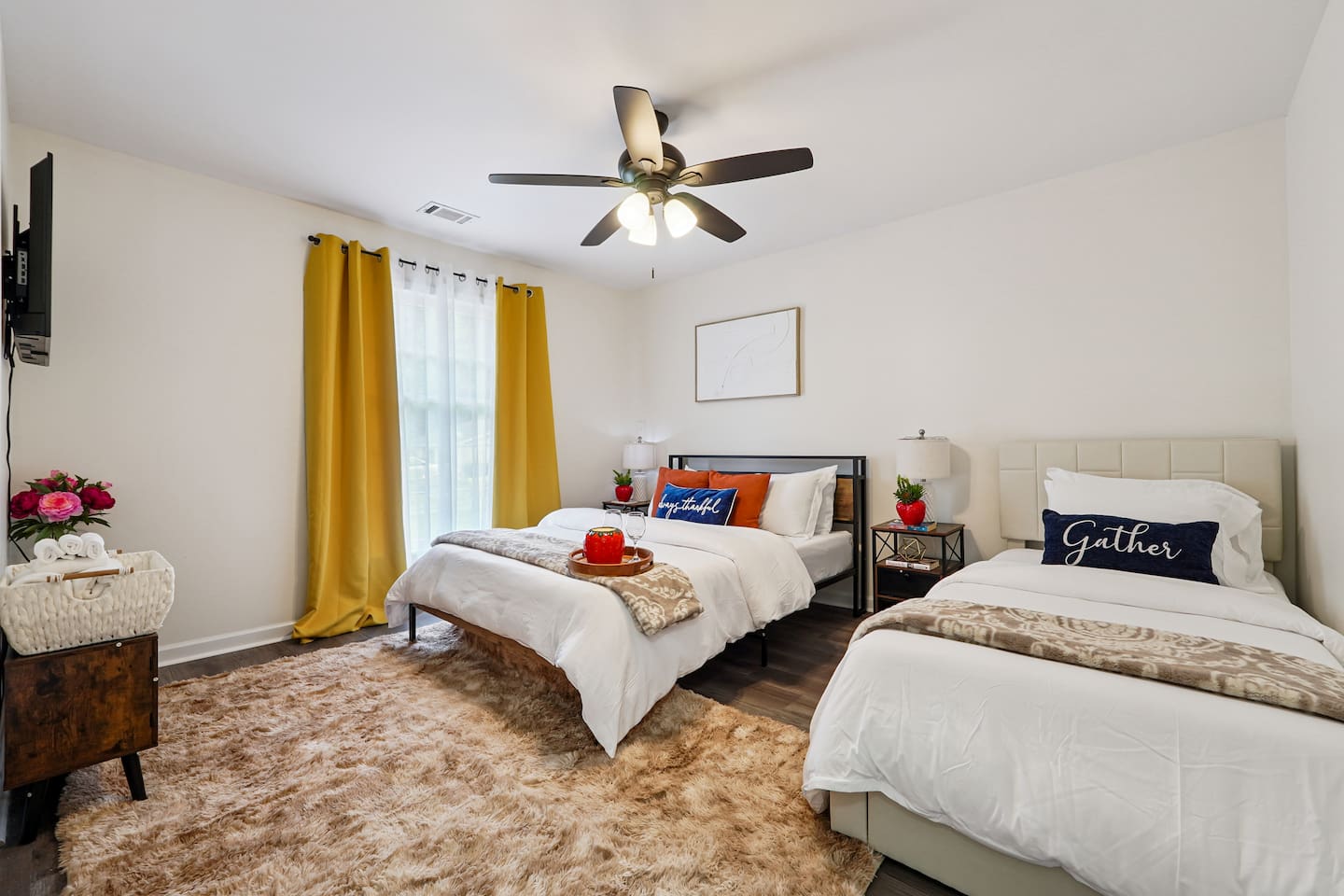 Another cozy bedroom featuring both a full bed and a twin bed, along with an Amazon Fire-powered Smart TV for your entertainment. This room includes 4 full-body towels, 4 washcloths, and 2 hand towels for your stay.