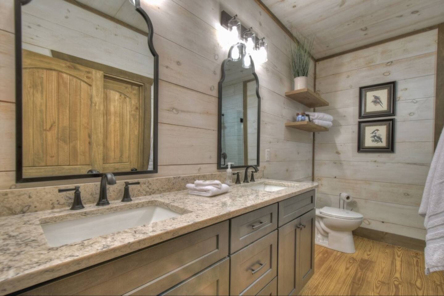 Master bathroom with his and hers sinks.  Walk in closet off the bathroom as well as the encased shower and tub (not in this photo)